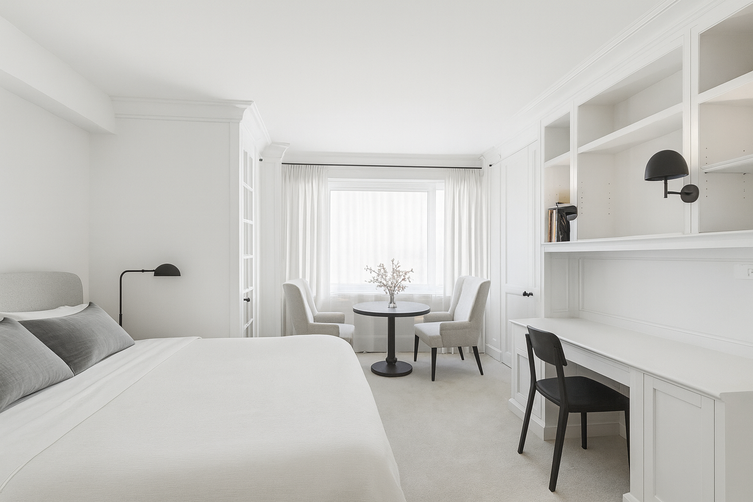 45 Sutton Place South, Unit 10F Manhattan, NY 10022 - Photo 8 of 15 a bedroom with a bed a table and chair