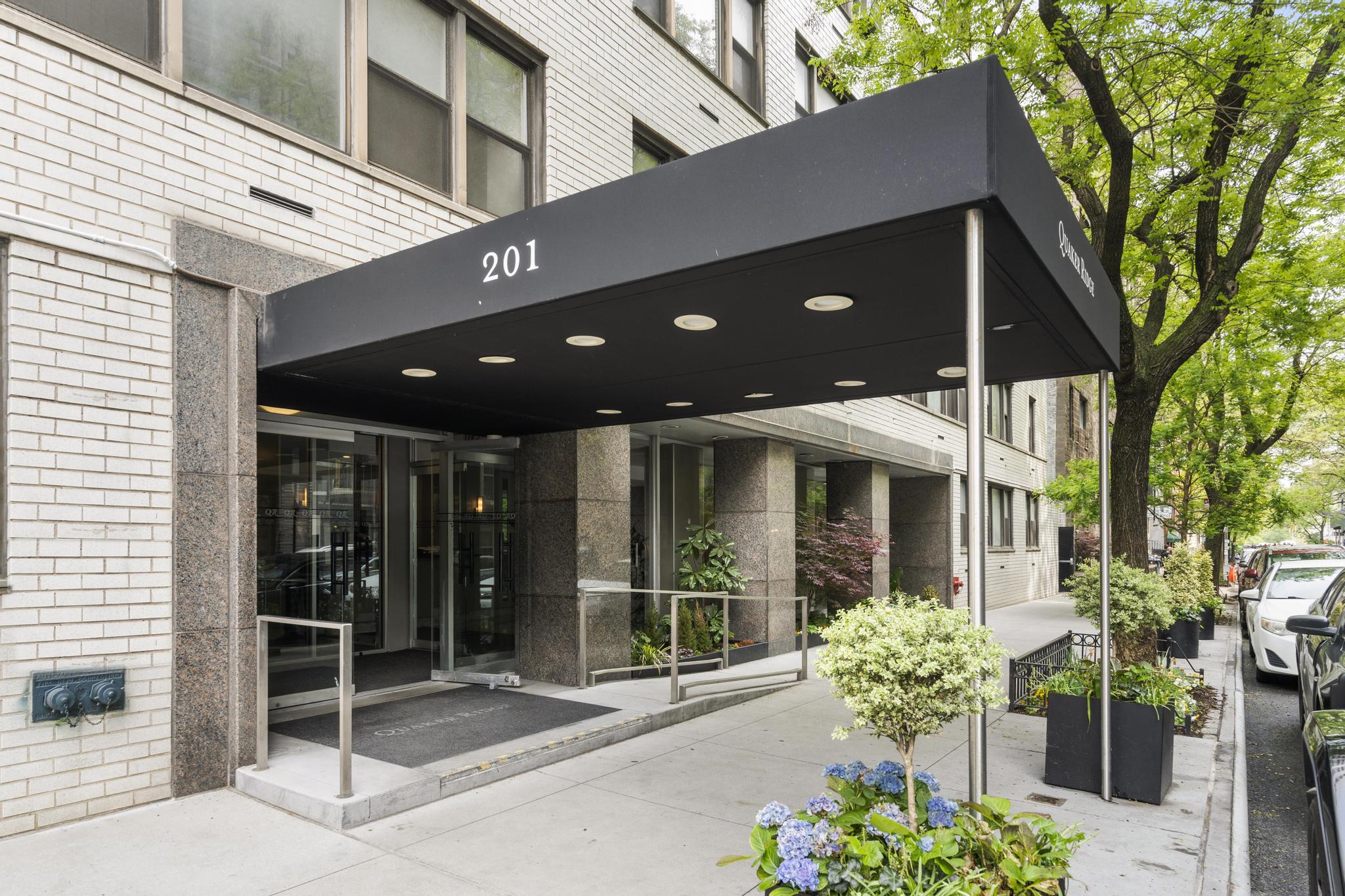 201 East 21st Street, Unit 8E Manhattan, NY 10010 - Photo 7 of 9 a front view of a house with a garden