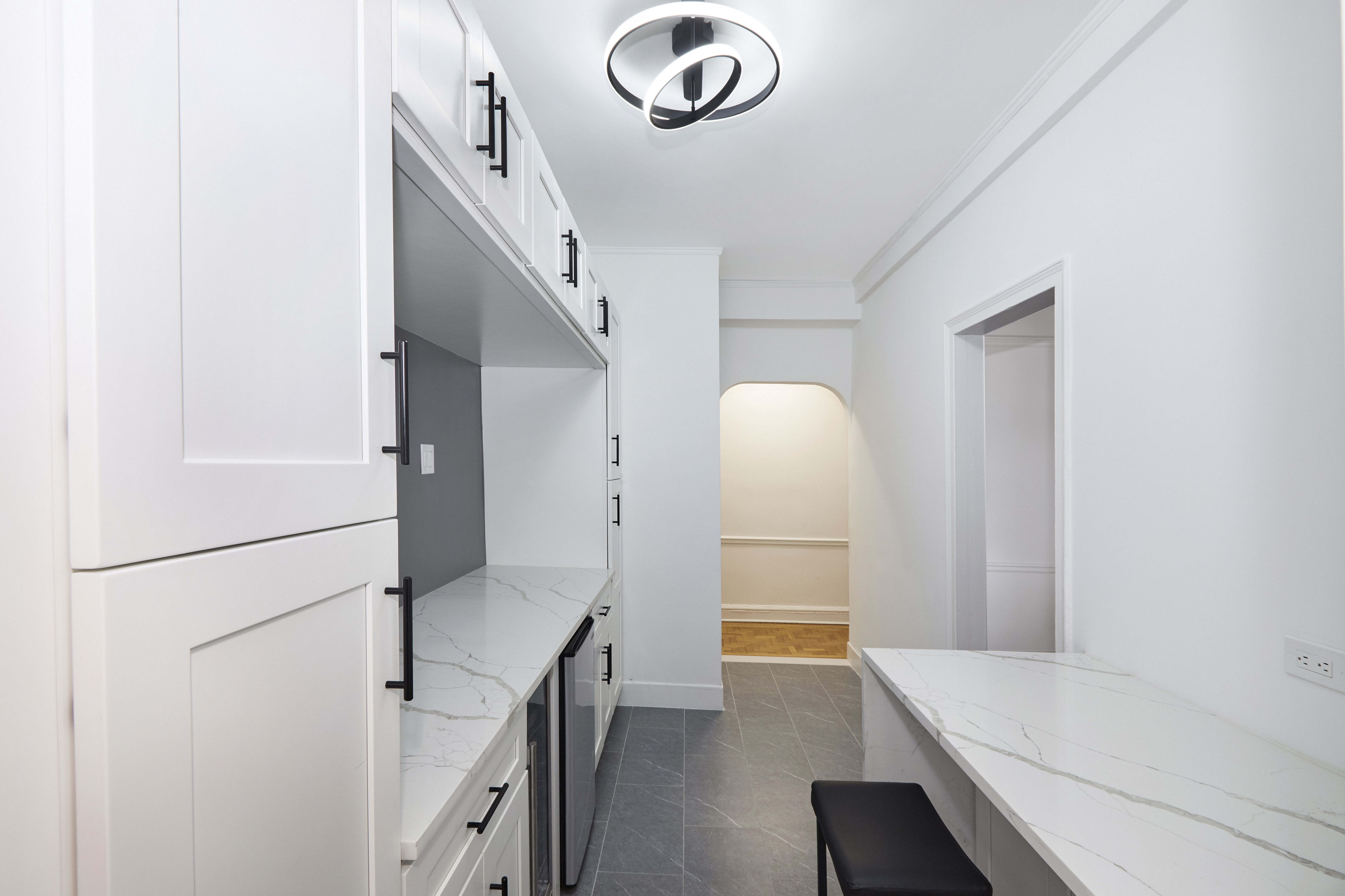 135 Eastern Parkway, Unit 9I Brooklyn, NY 11238 - Photo 2 of 17 a hallway with washer and dryer