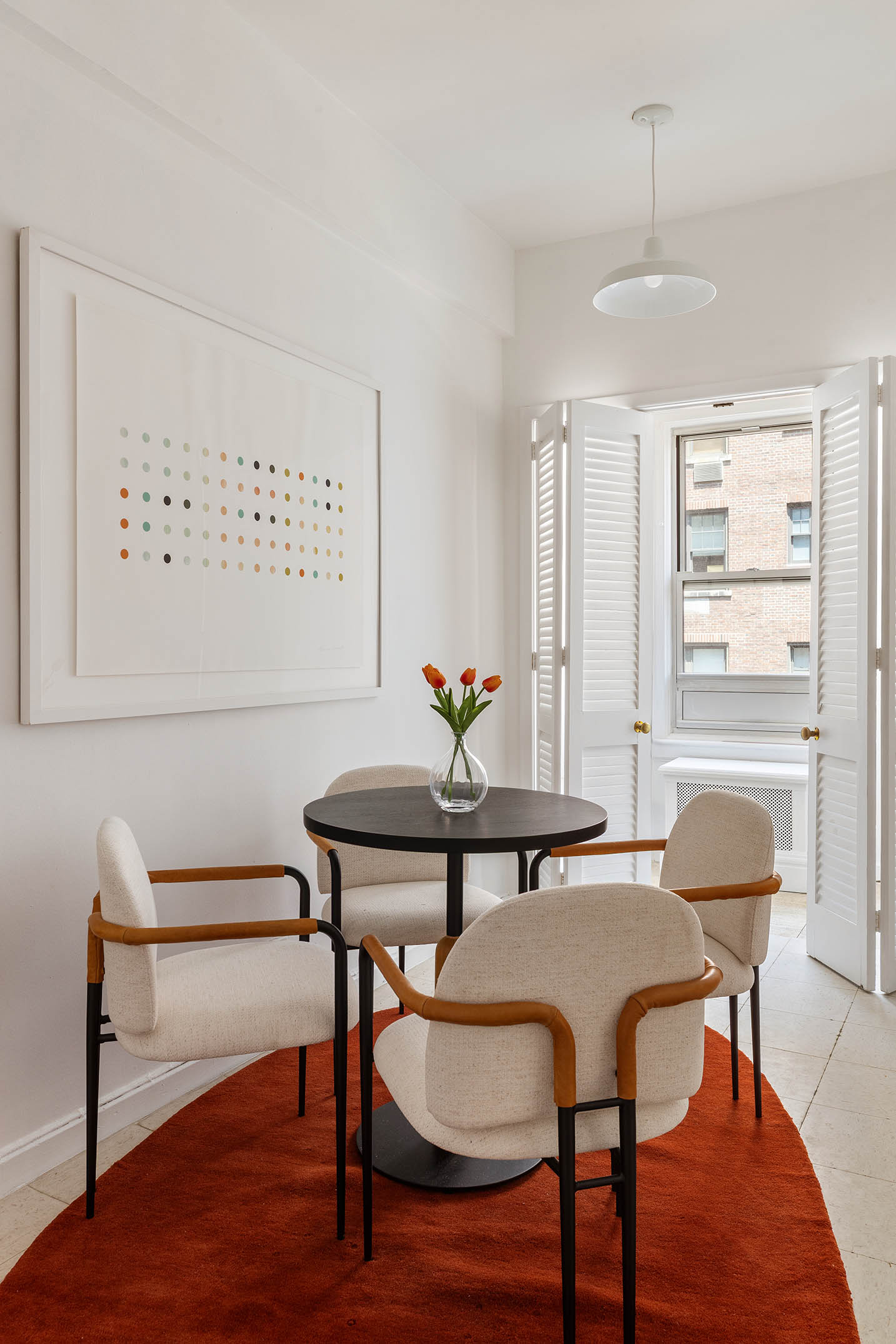 975 Park Avenue, Unit 10B Manhattan, NY 10028 - Photo 15 of 17 a view of a dining room with furniture and wooden floor