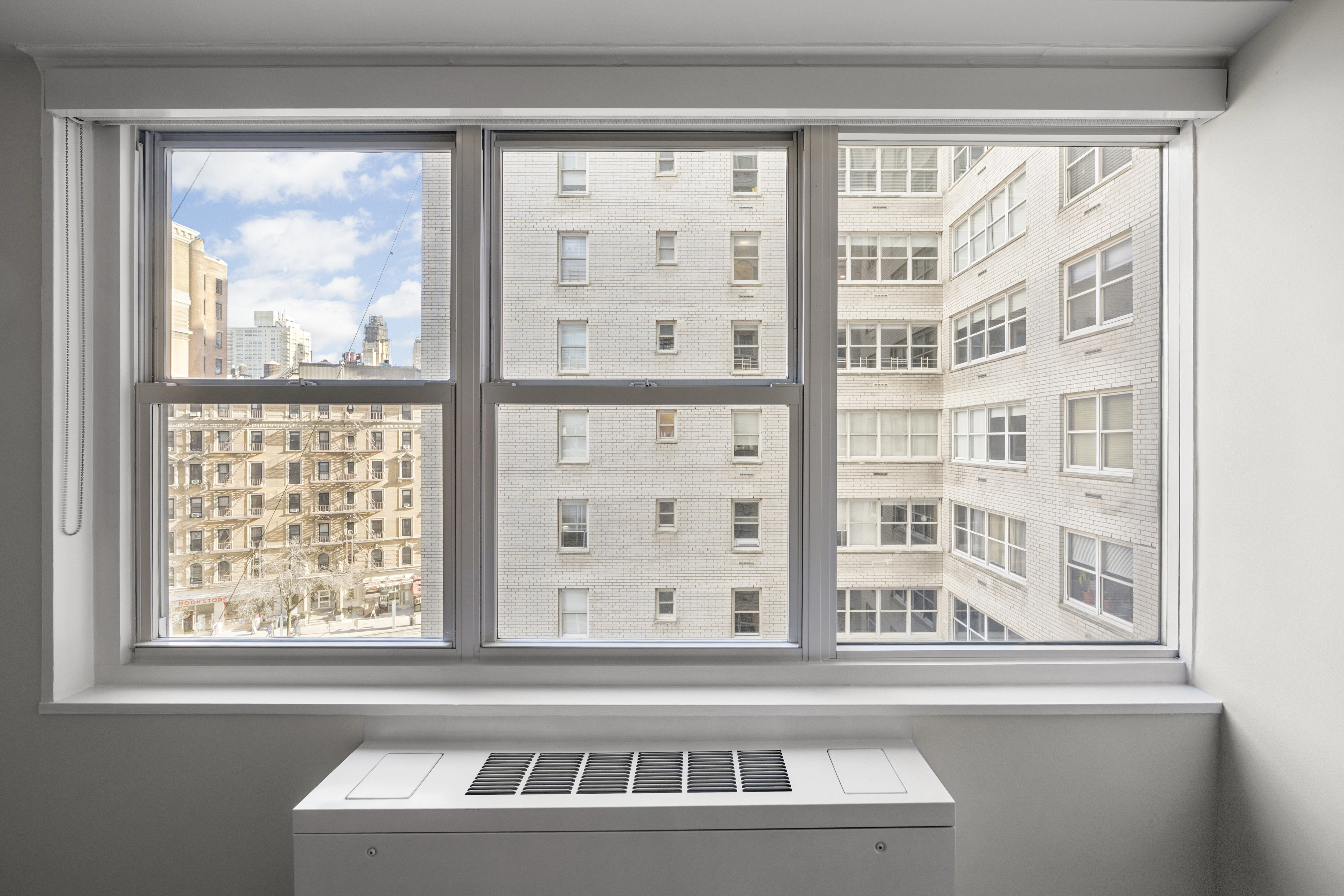155 West 68th Street, Unit 815 Manhattan, NY 10023 - Photo 3 of 14 a view of a building from a windows