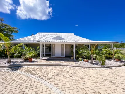 a front view of a building with garden