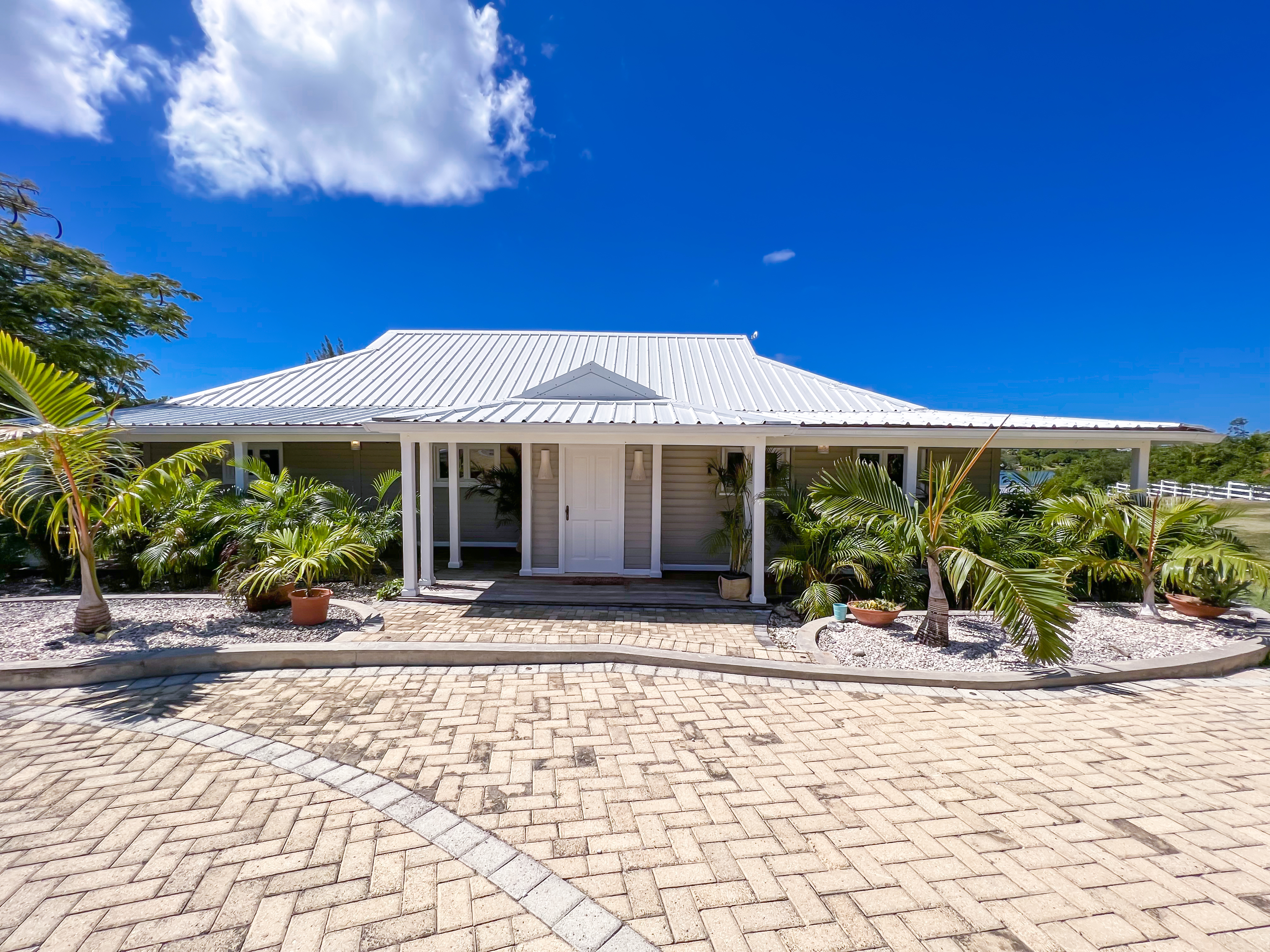 a front view of a building with garden