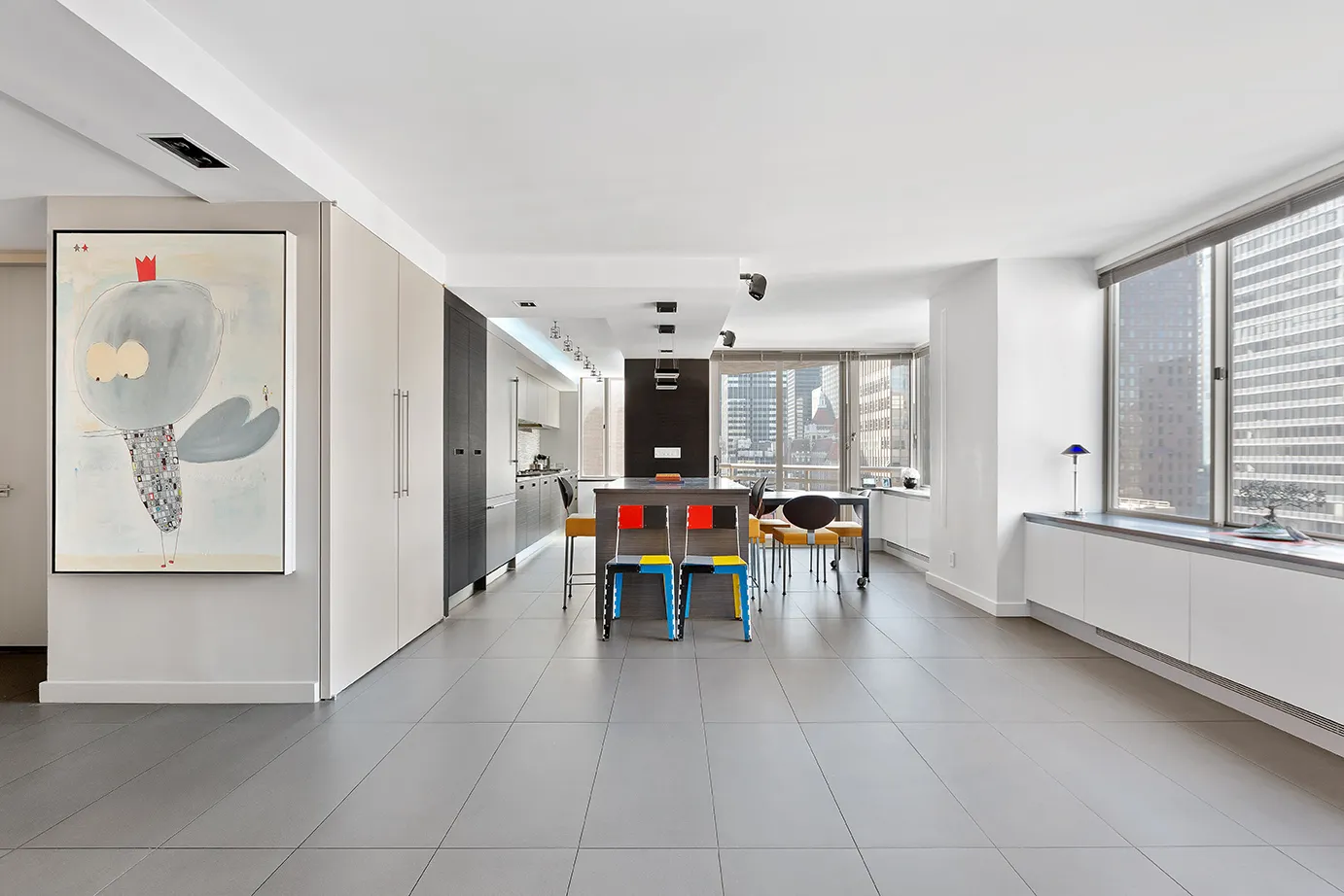 a living room with furniture and white walls
