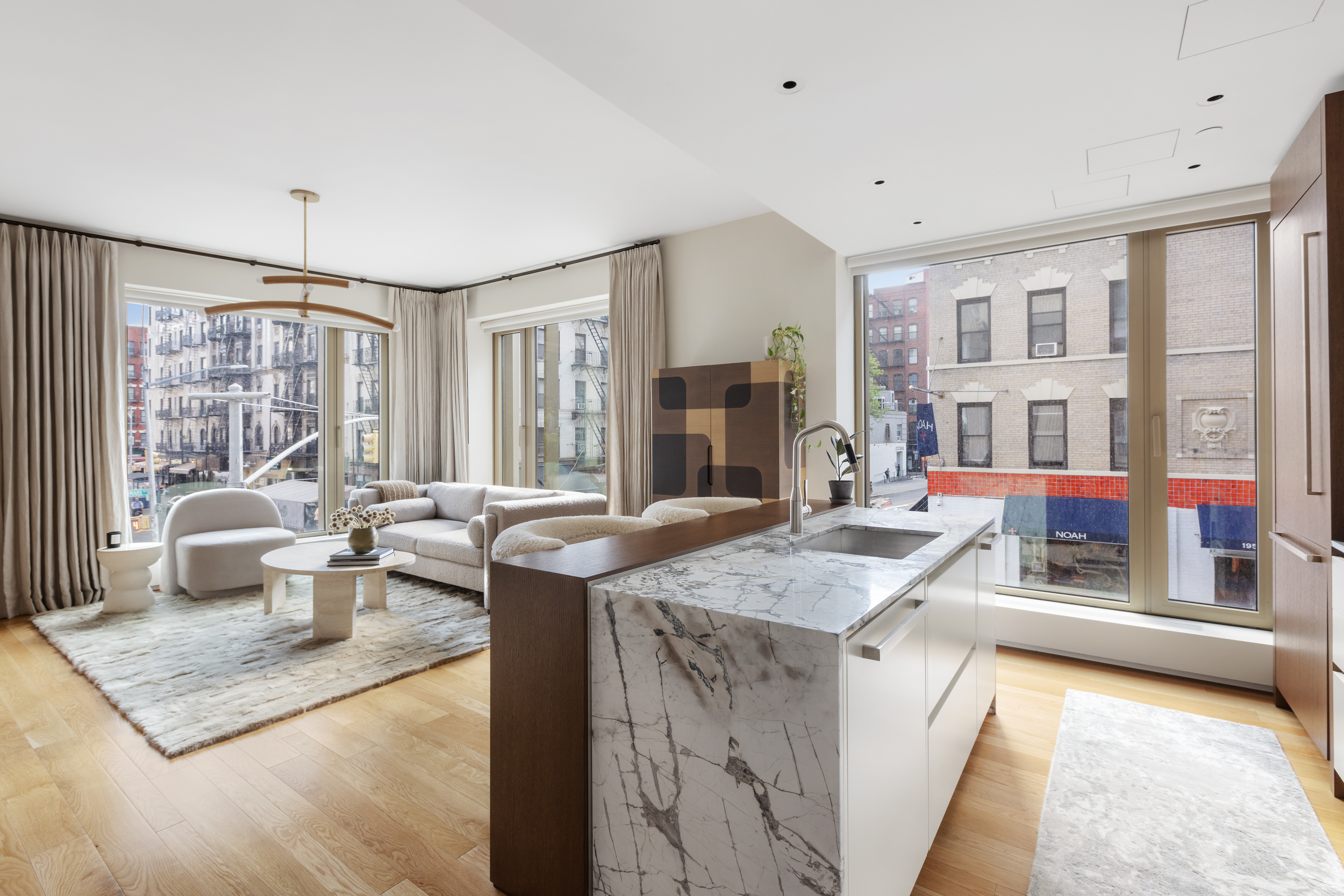 75 Kenmare Street, Unit 2D Manhattan, NY 10012 - Photo 4 of 15 a view of a living room and kitchen