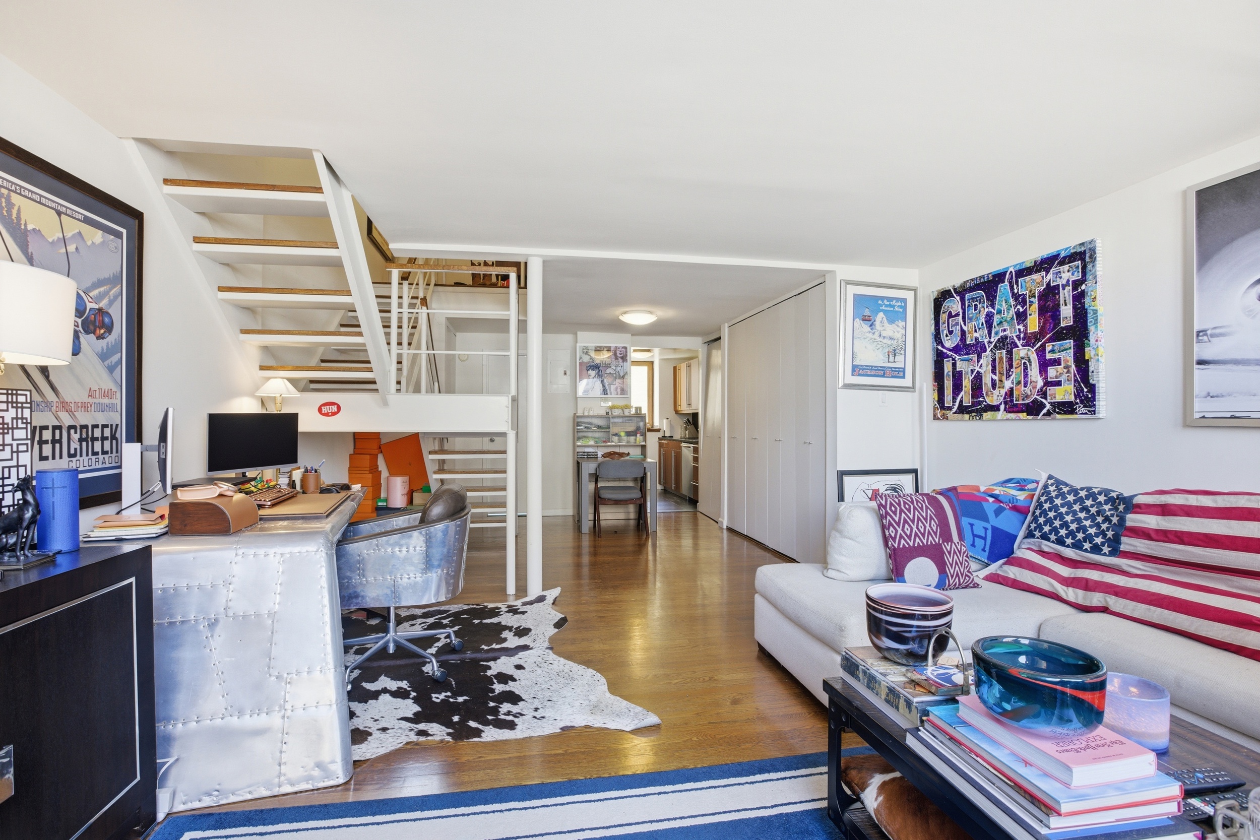 305 2nd Avenue, Unit 518 Manhattan, NY 10003 - Photo 4 of 19 a living room with furniture and a wooden floor