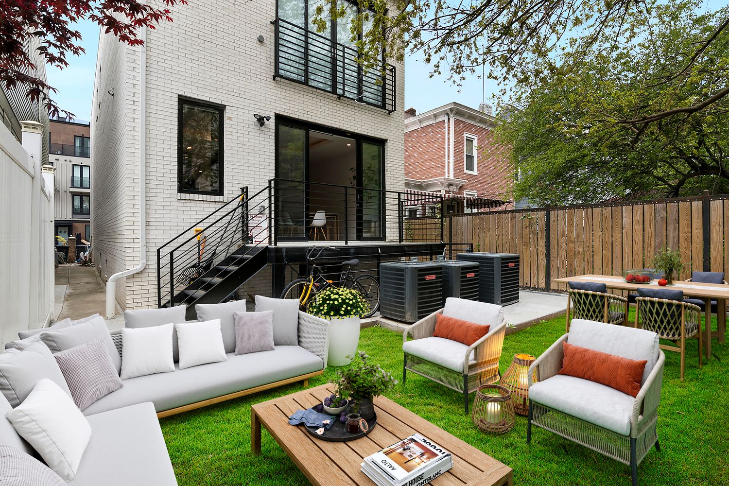 296 Fenimore Street Brooklyn, NY 11225 - Photo 14 of 19 a view of a patio with couches chairs and a fire pit