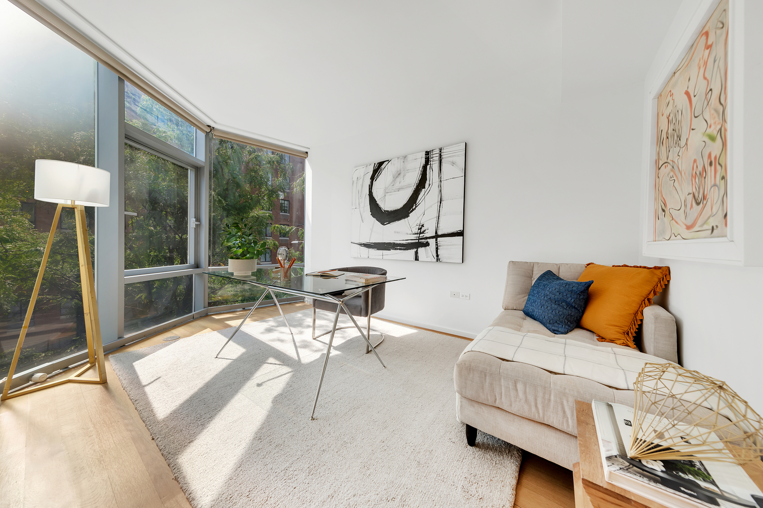 425 West 53rd Street, Unit 419 Manhattan, NY 10019 - Photo 4 of 18 a bedroom with furniture and a large window