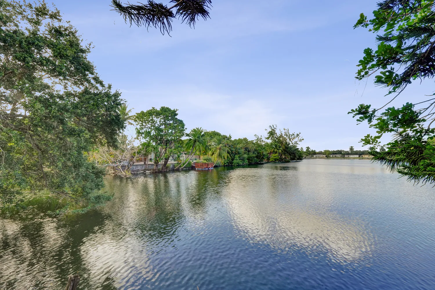 an aerial view of a house with a lake view