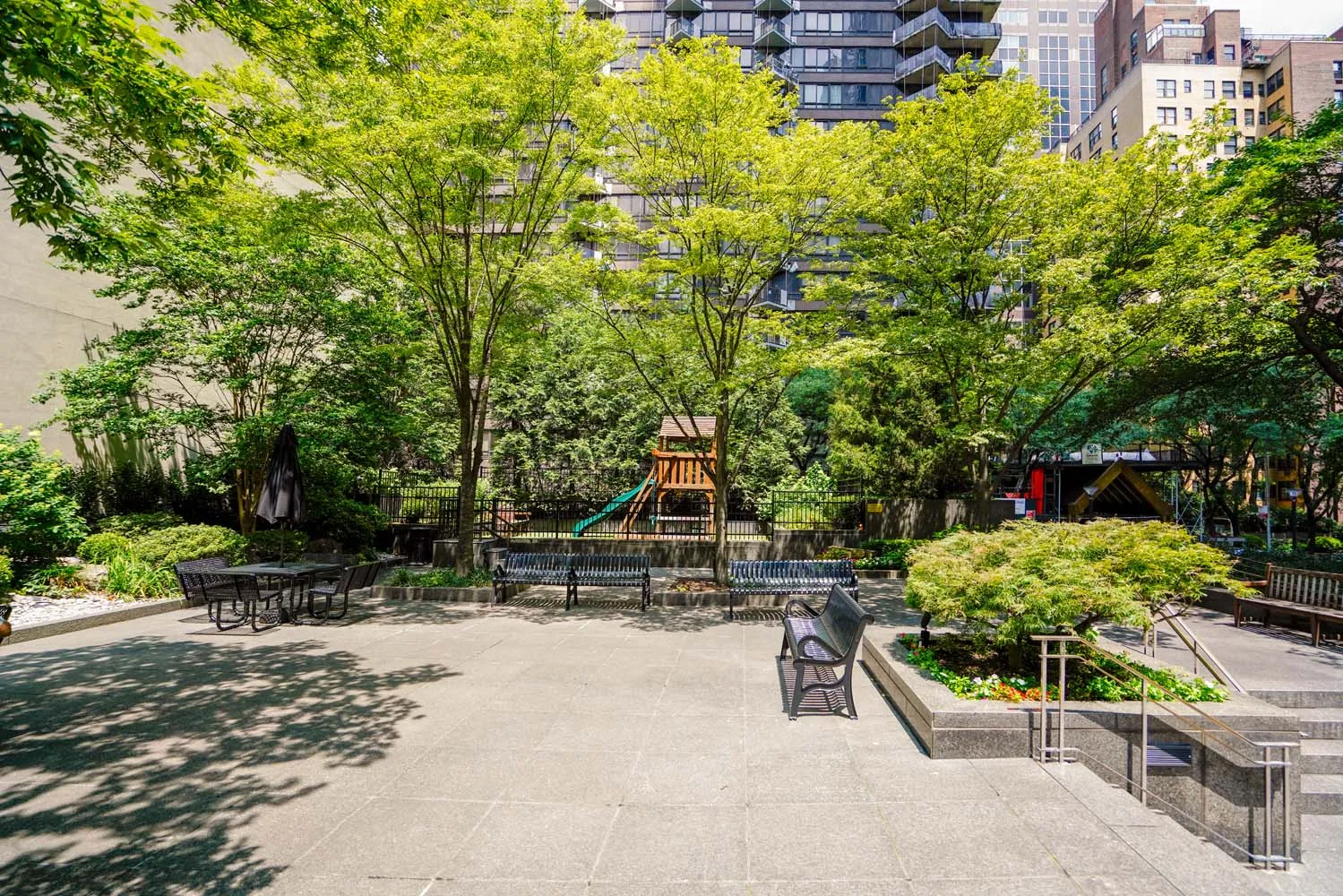 a view of a bench in a backyard