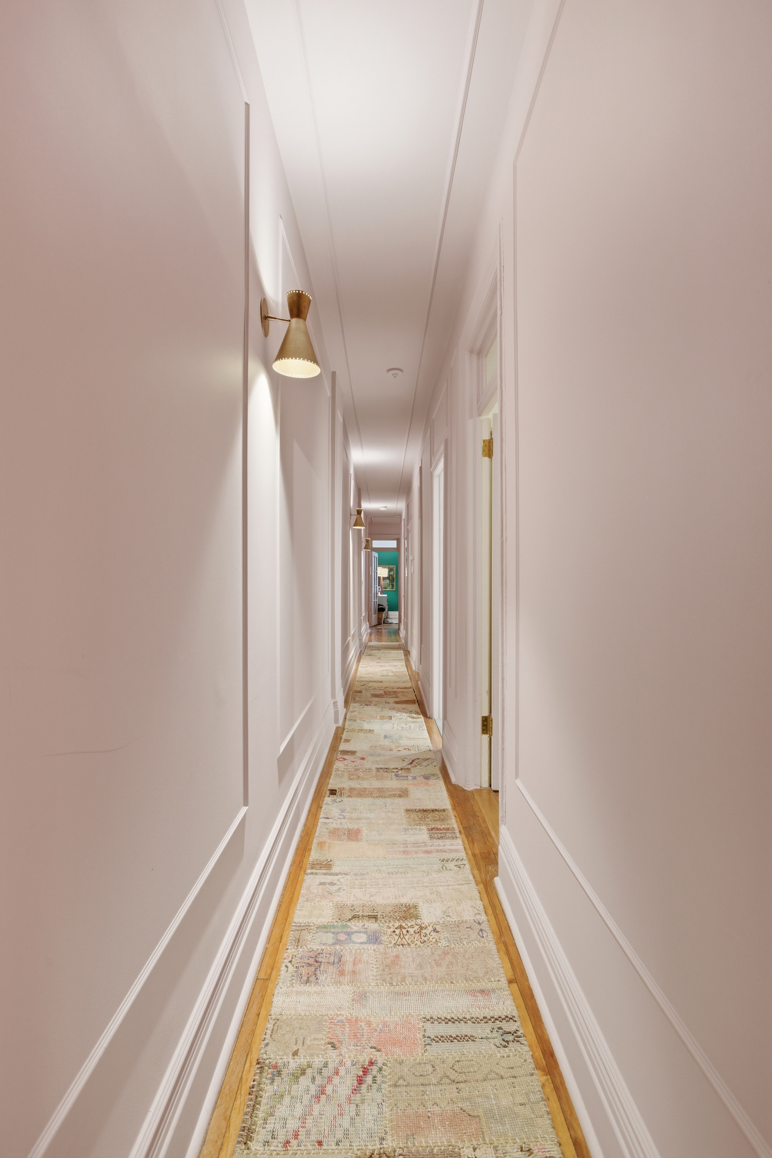 532 West 111th Street, Unit 26 Manhattan, NY 10025 - Photo 7 of 14 a view of a hallway with wooden floor and staircase