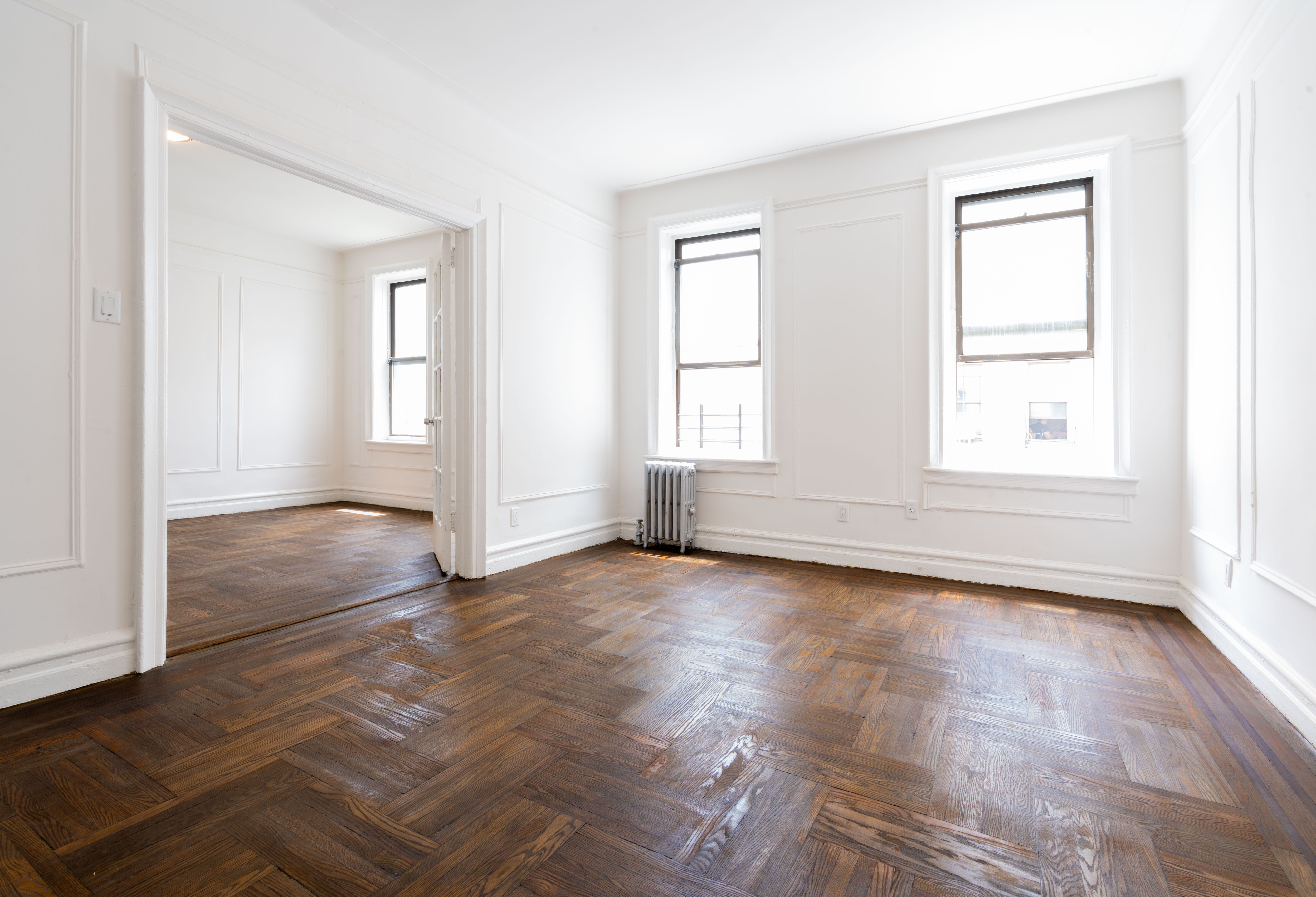 1405 Prospect Place, Unit B11 Brooklyn, NY 11213 - Photo 5 of 12 an empty room with wooden floor and windows