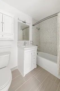 a bathroom with a sink a toilet and a bathtub