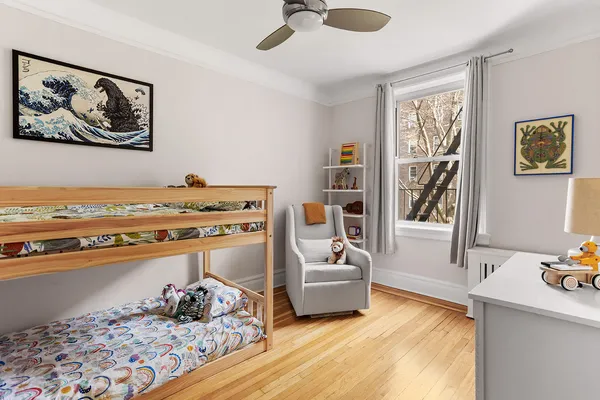 a room with furniture and view of kitchen