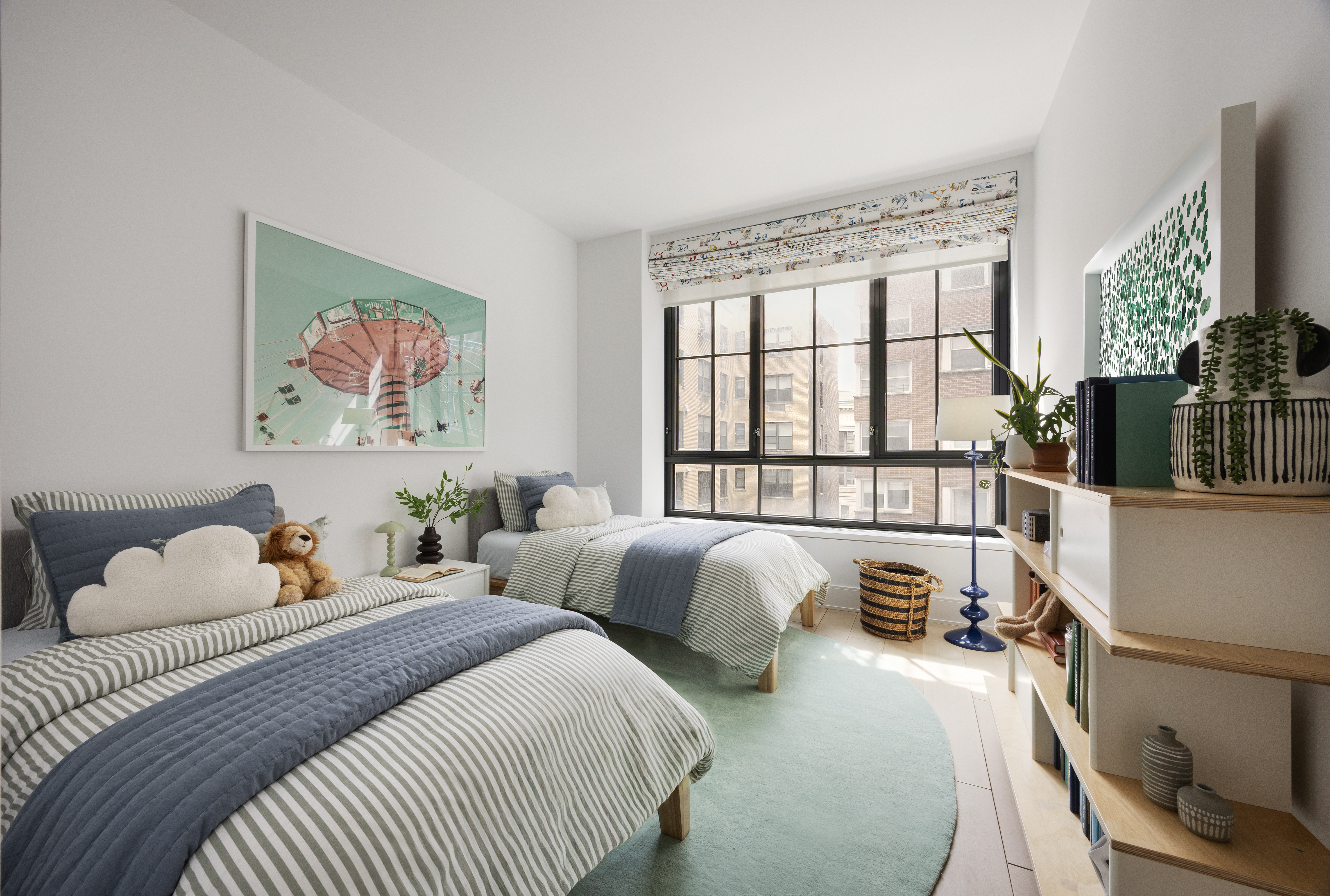 60 East 86th Street, Unit 6 Manhattan, NY 10028 - Photo 6 of 10 a bedroom with two beds and a large window