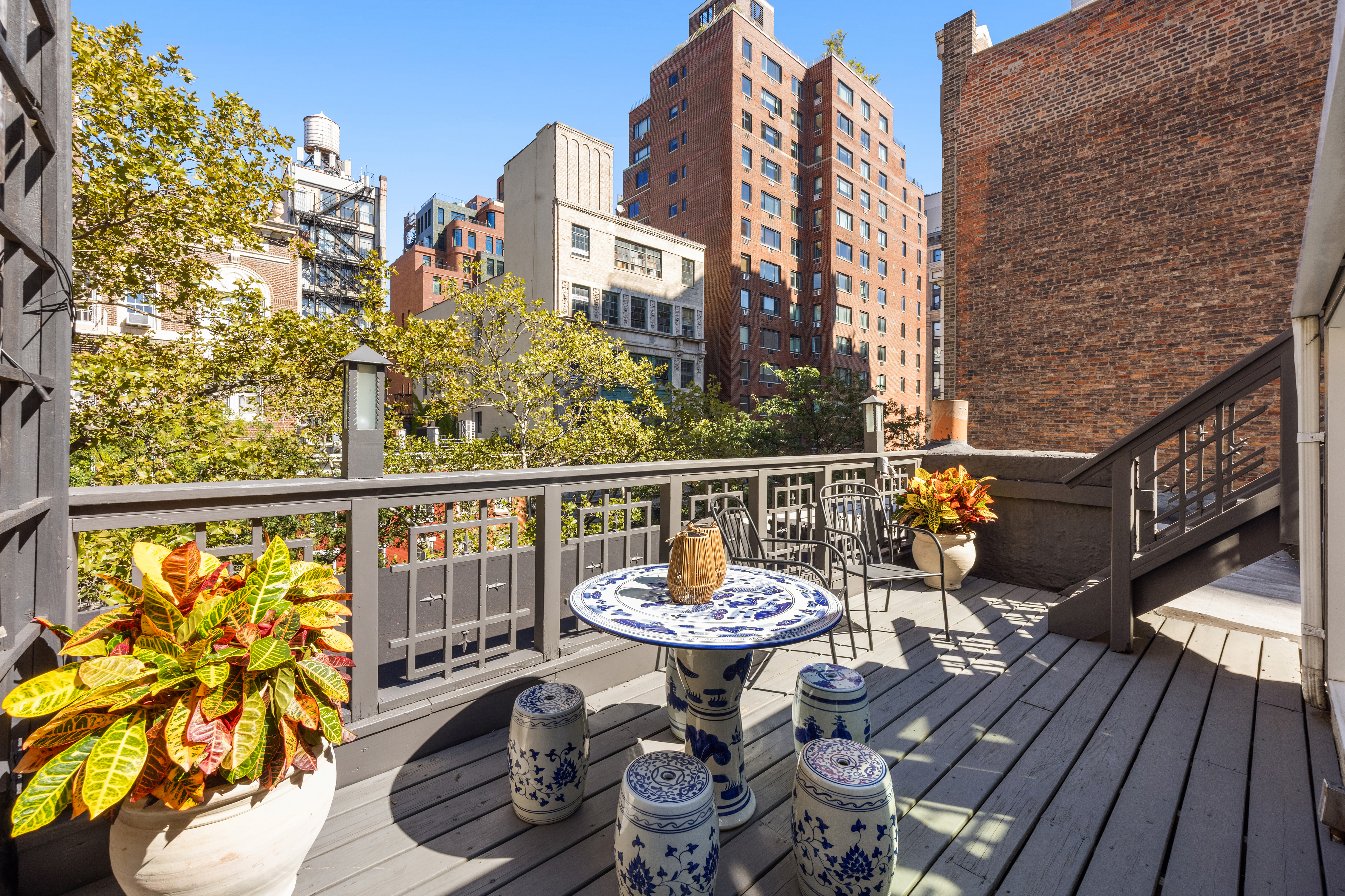 112 West 13th Street Manhattan, NY 10011 - Photo 34 of 46 a view of a balcony with two chairs and a potted plant