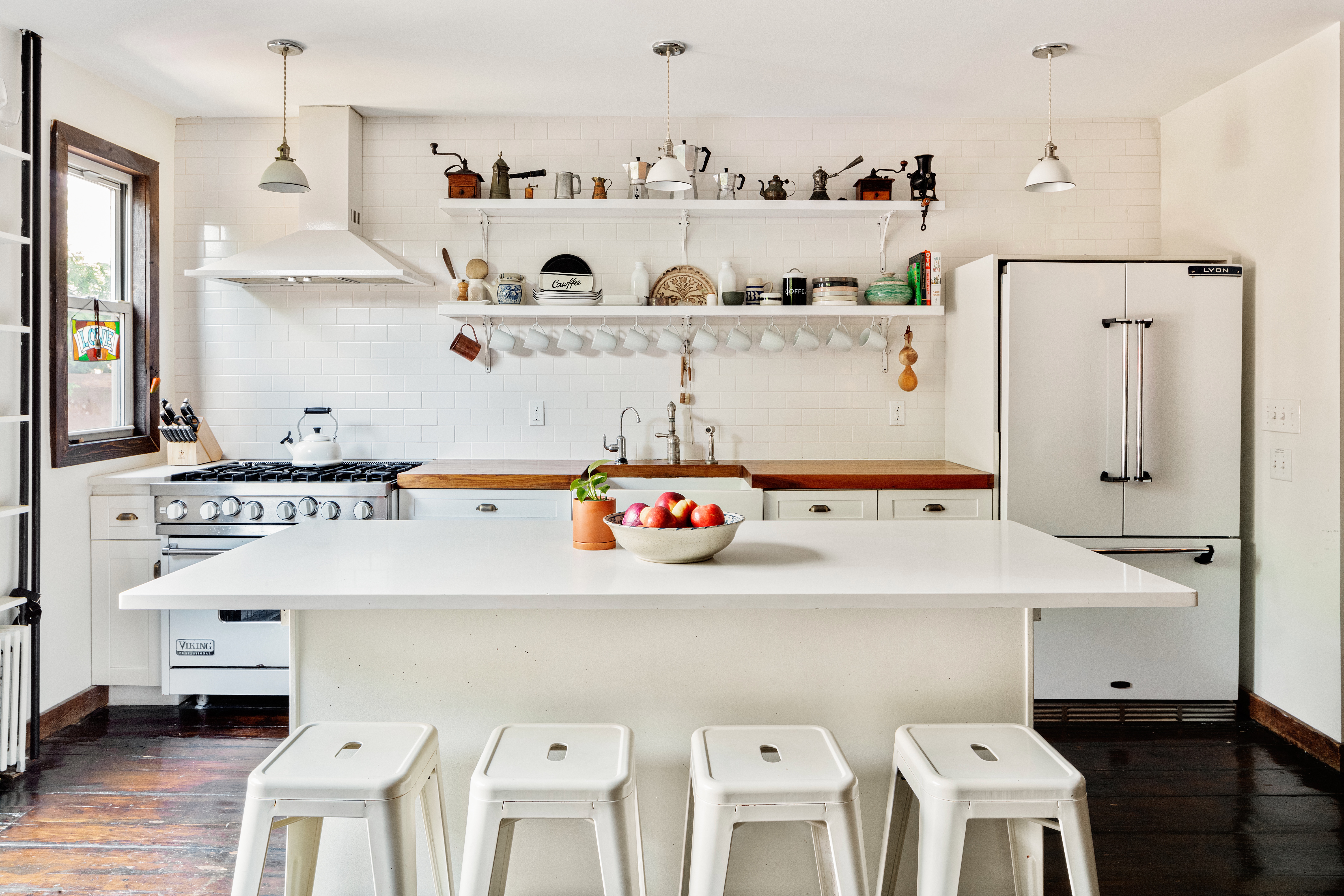 111 Powers Street Brooklyn, NY 11211 - Photo 4 of 16 a room with cabinets a sink and a refrigerator