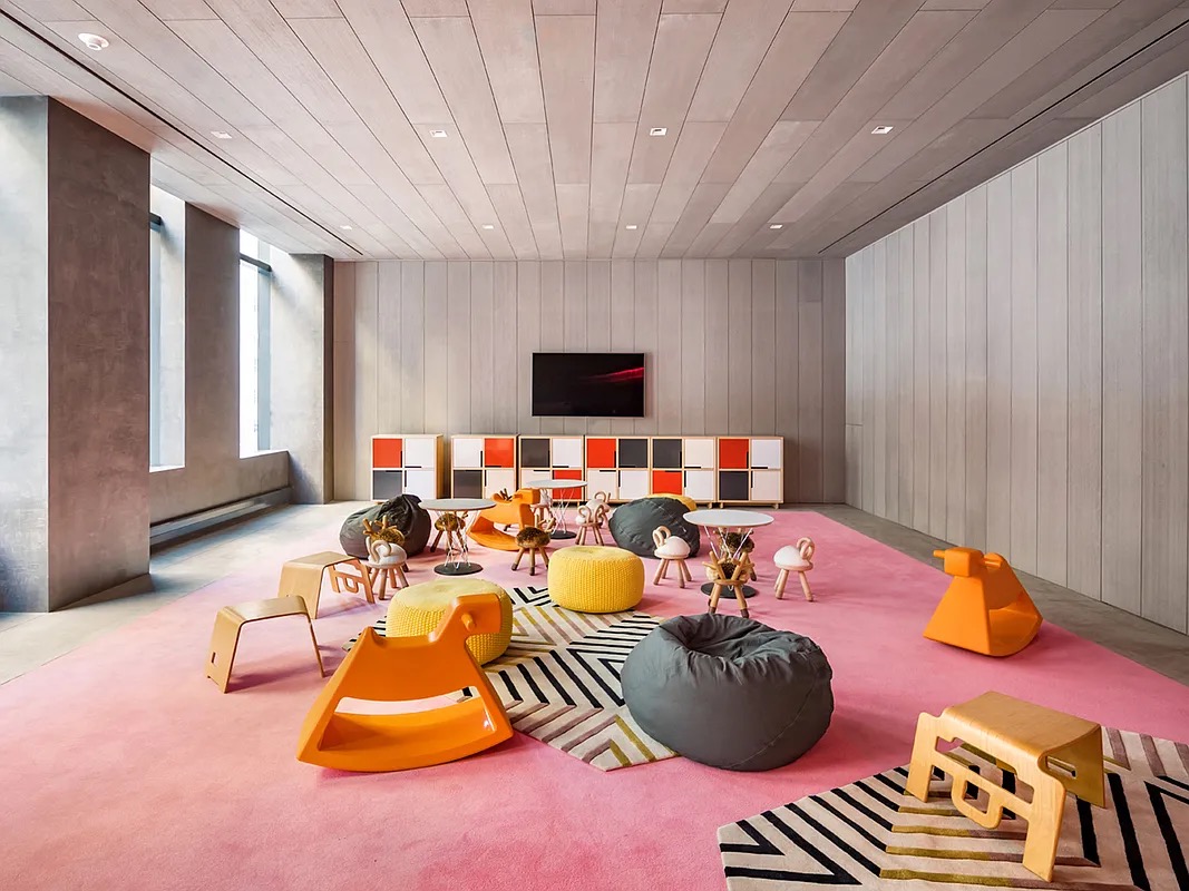 121 East 22nd Street, Unit N1405 Manhattan, NY 10010 - Photo 18 of 19 a living room with furniture and a flat screen tv