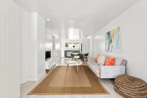 a living room with furniture and a rug