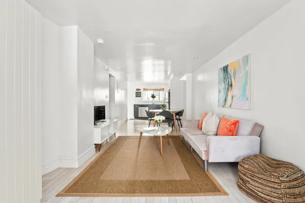 a living room with furniture and a rug