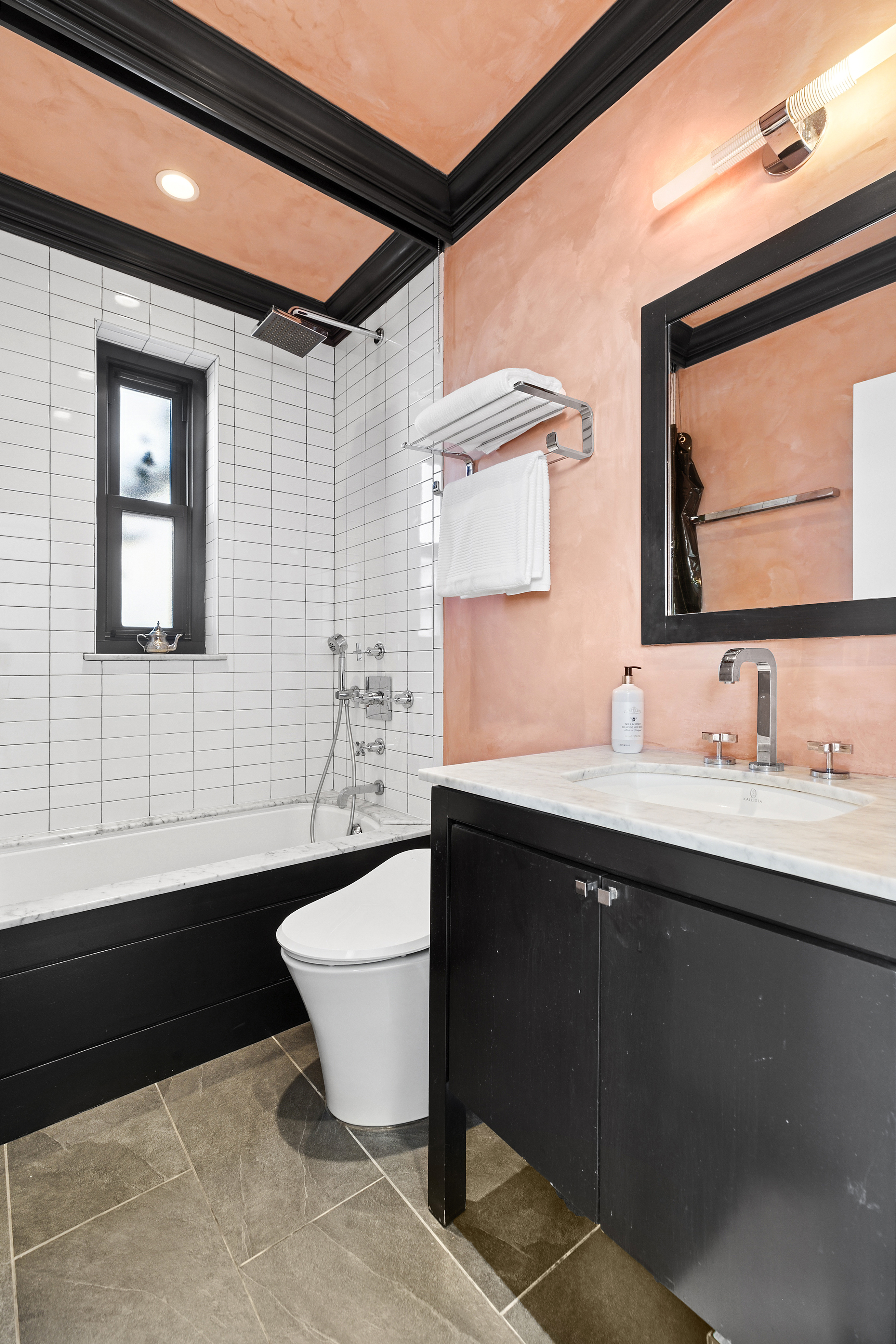 310 West 106th Street, Unit PH17B Manhattan, NY 10025 - Photo 6 of 9 a bathroom with a sink and a mirror