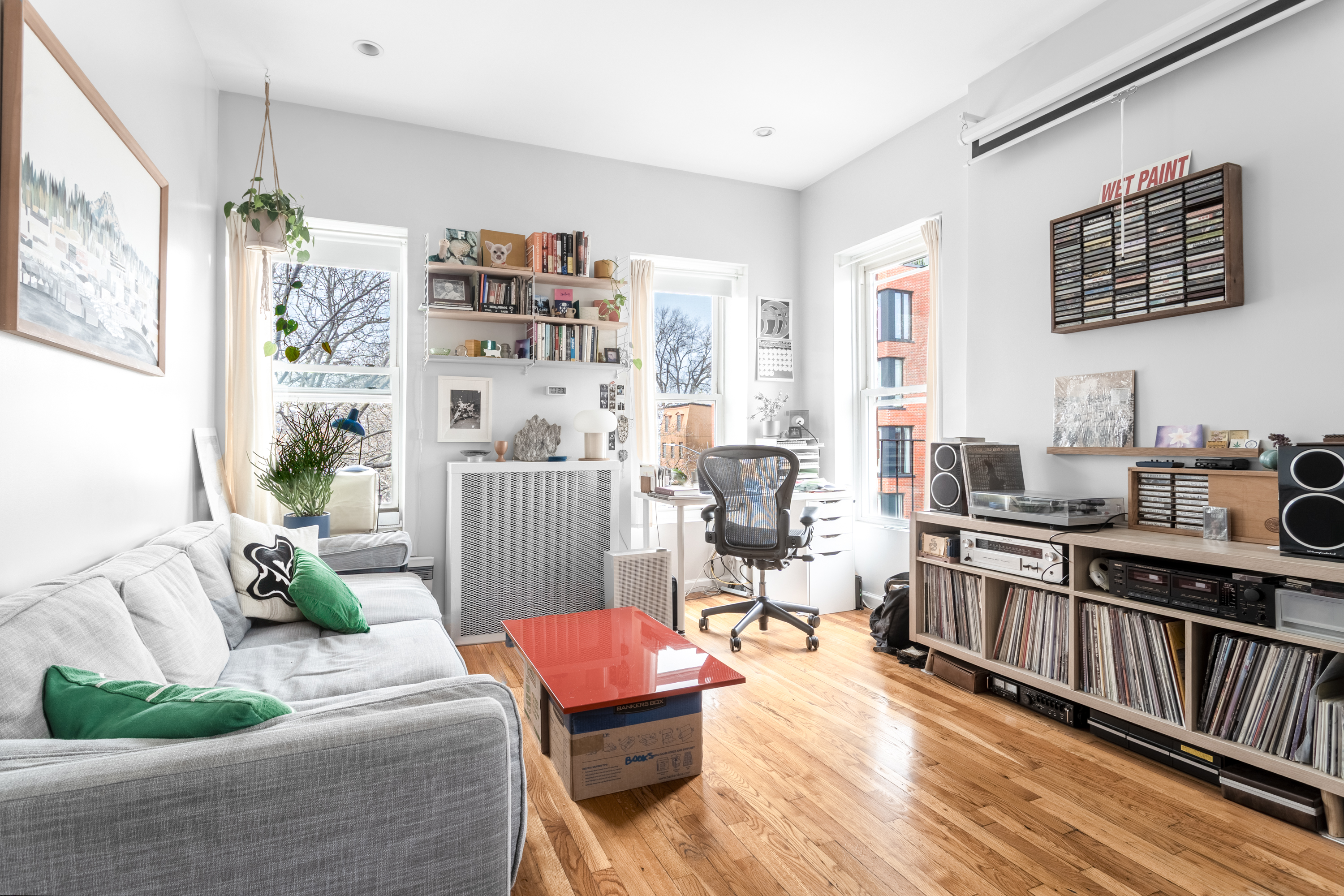 258 Halsey Street, Unit 3 Brooklyn, NY 11216 - Photo 1 of 10 a living room with furniture fireplace and a large window