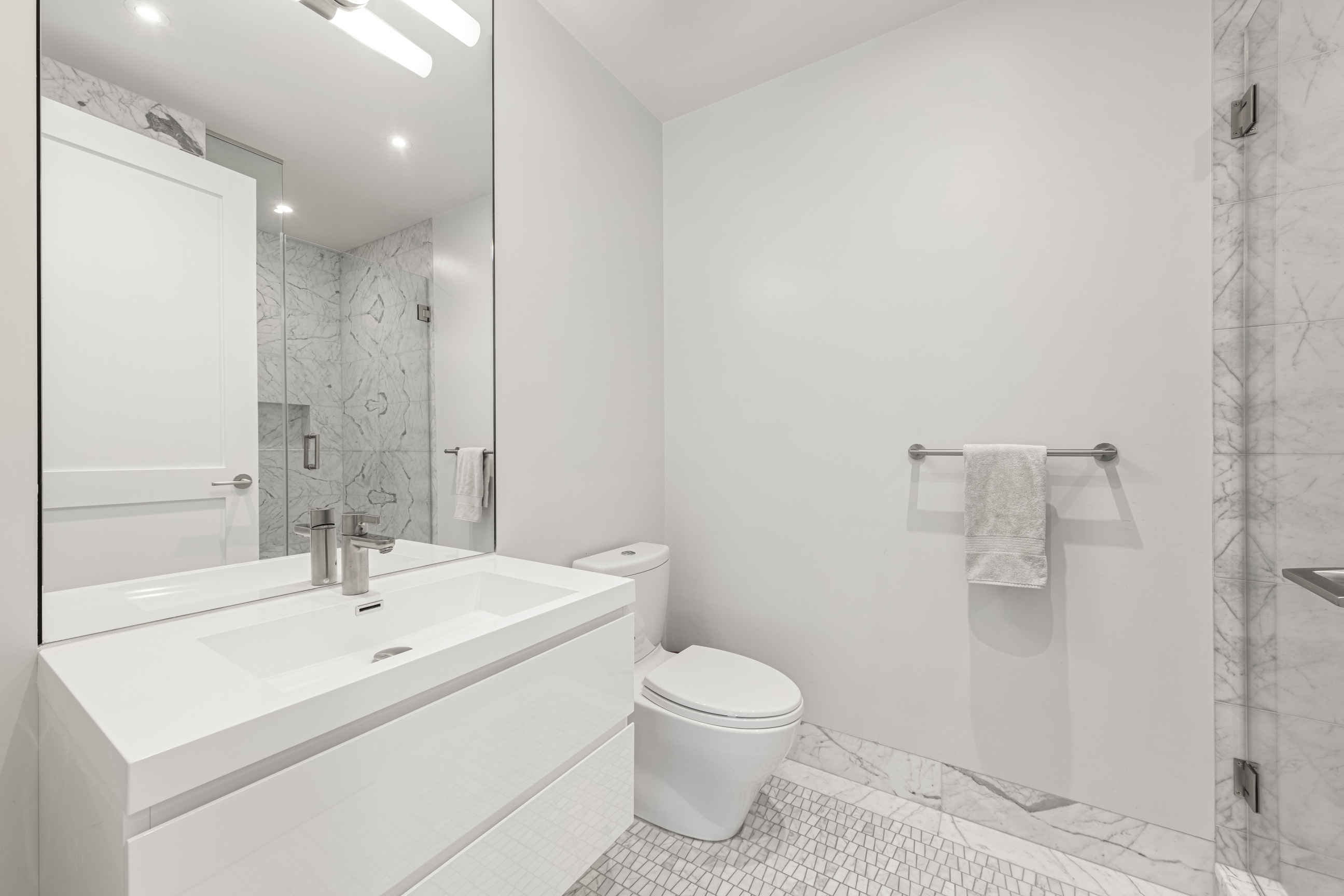 134 West 83rd Street, Unit 4 Manhattan, NY 10024 - Photo 14 of 17 a bathroom with a sink a toilet and shower