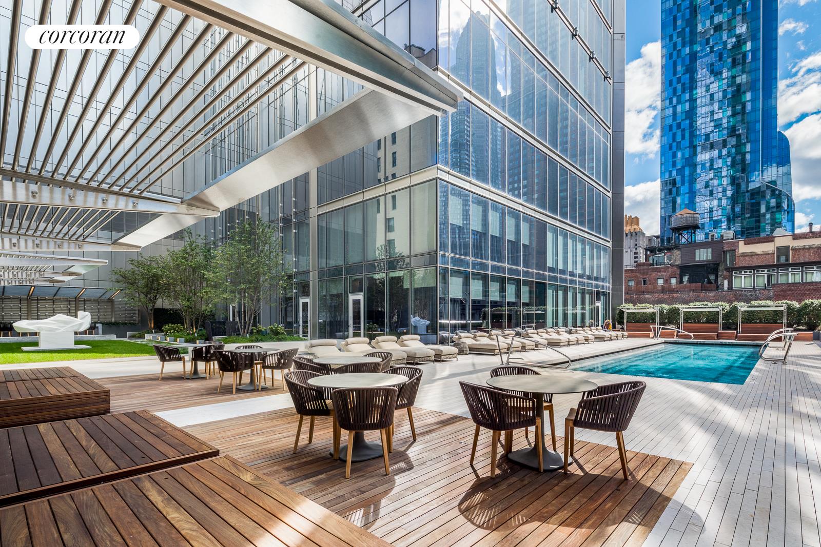 217 West 57th Street, Unit 58W Manhattan, NY 10019 - Photo 20 of 30 a view of a building with sitting area