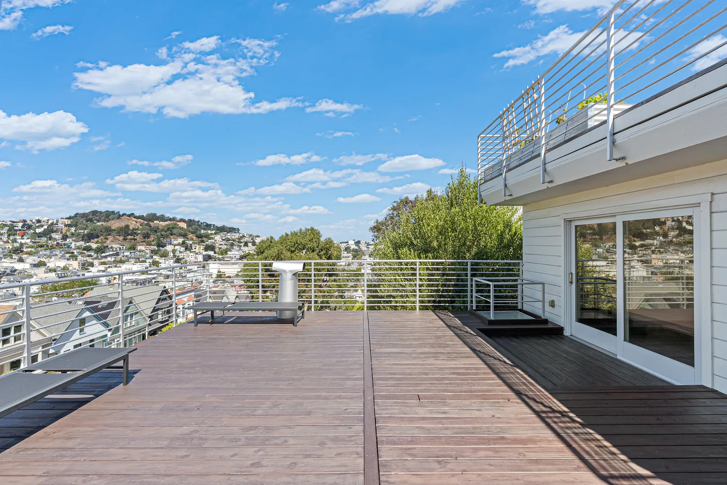 a view of a balcony with wooden floor