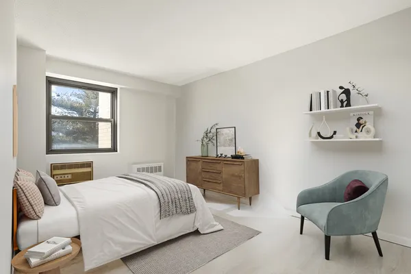 a bedroom with a bed and window