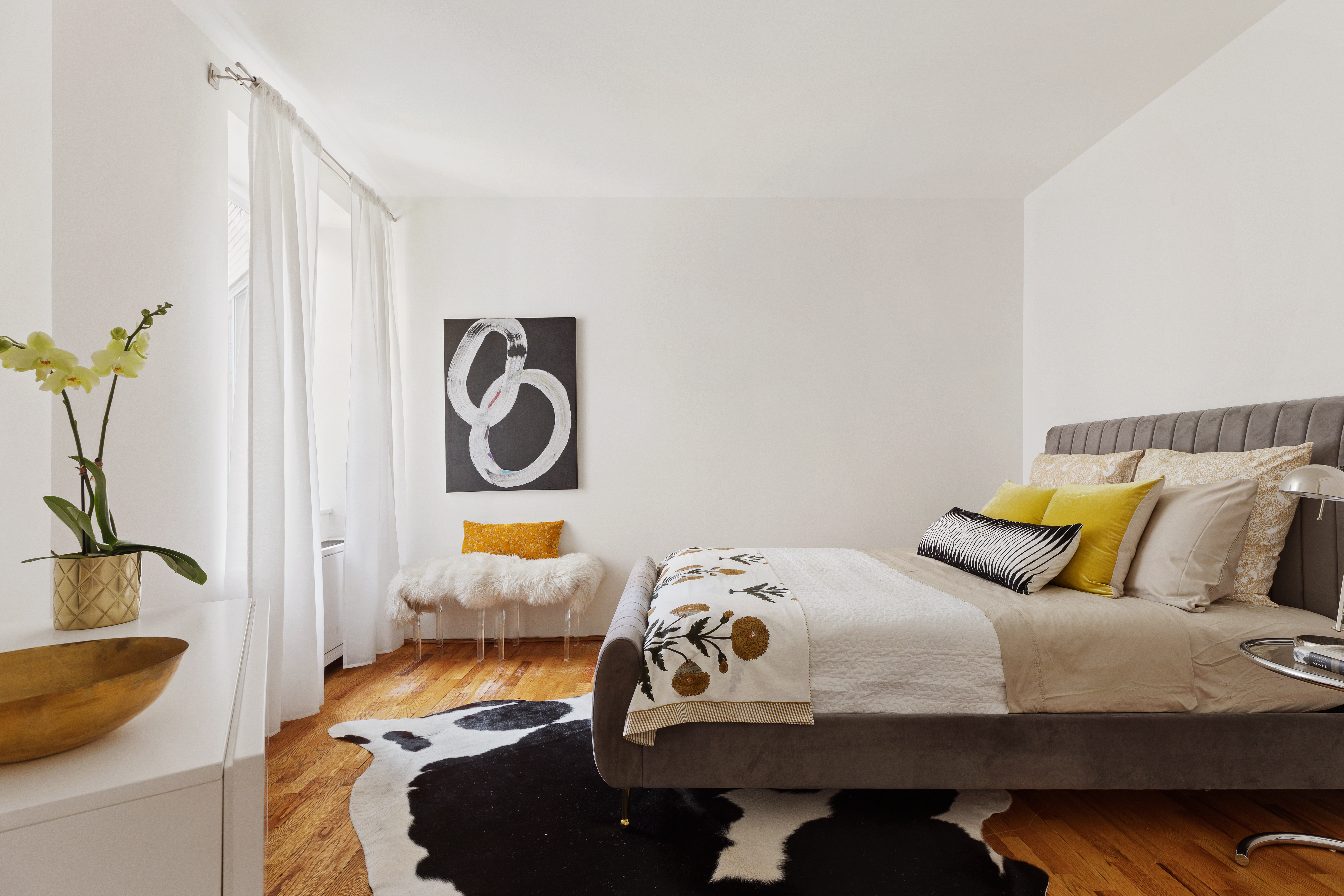 167 Perry Street, Unit 4K Manhattan, NY 10014 - Photo 6 of 11 a bedroom with bed and a potted plant