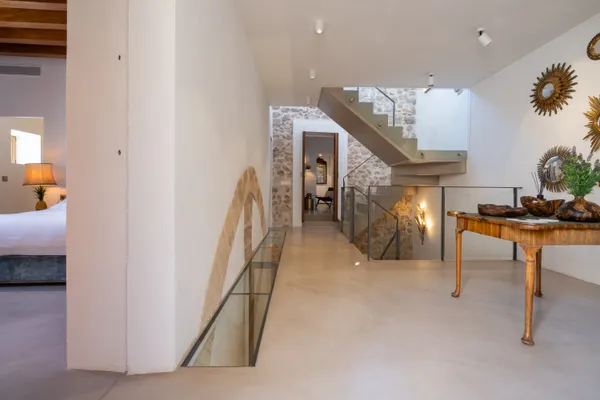 a view of a hallway with a living room