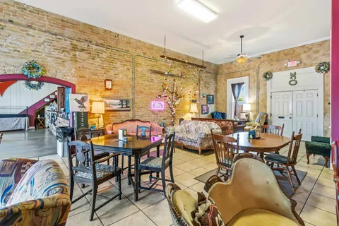 a living room with lots of furniture and toys