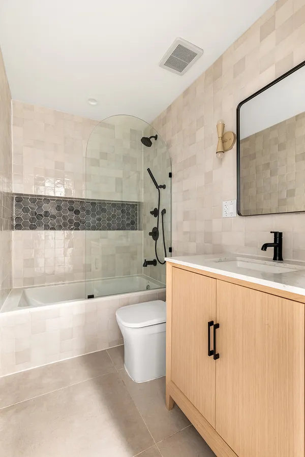 a bathroom with a bathtub and a shower