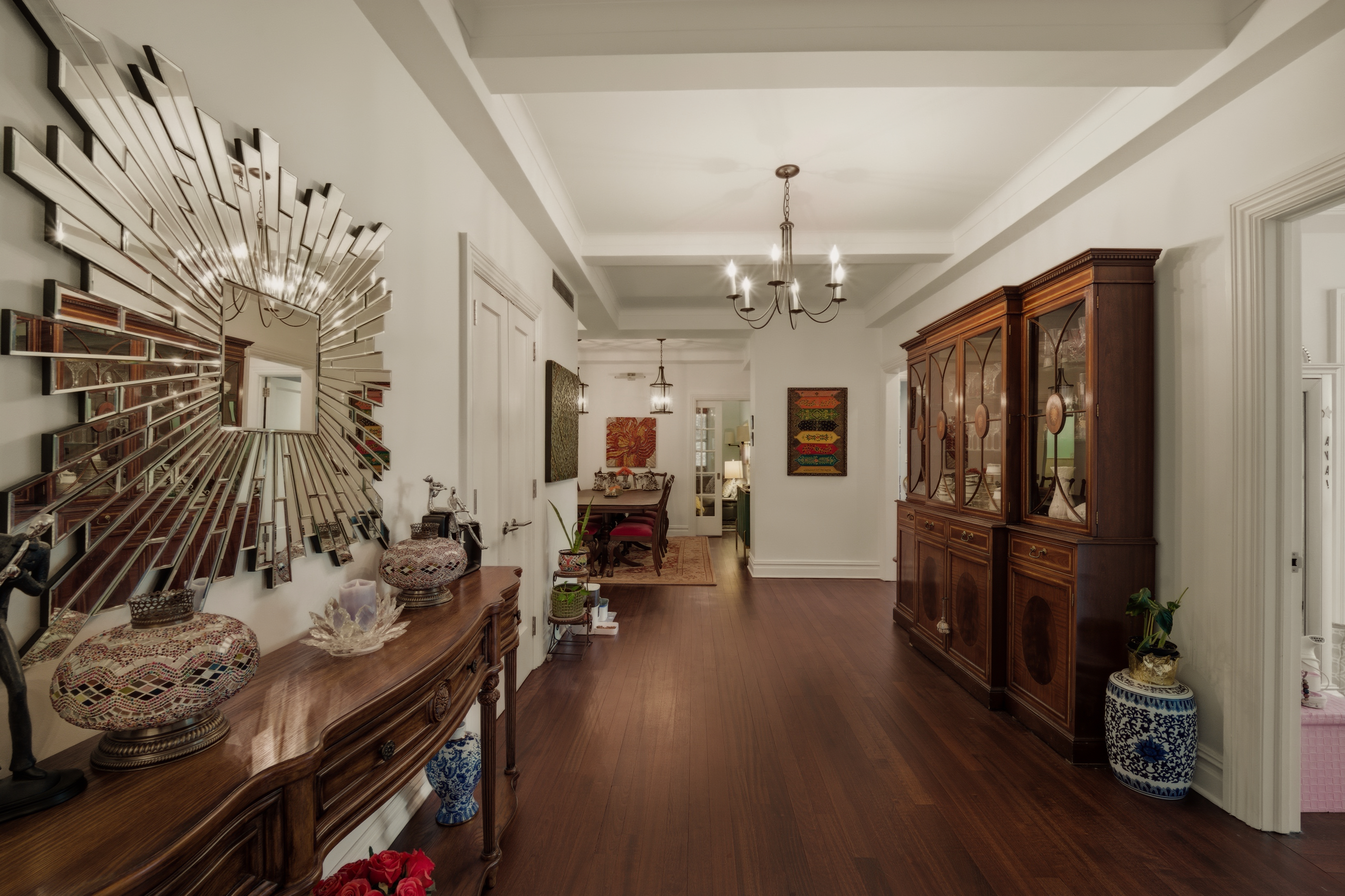 1158 5th Avenue, Unit 4A Manhattan, NY 10128 - Photo 7 of 23 a view of a livingroom with furniture hardwood floor and a ceiling fan