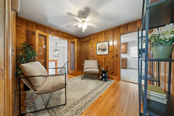 a view of a livingroom with furniture and a floor to ceiling window or wooden floor