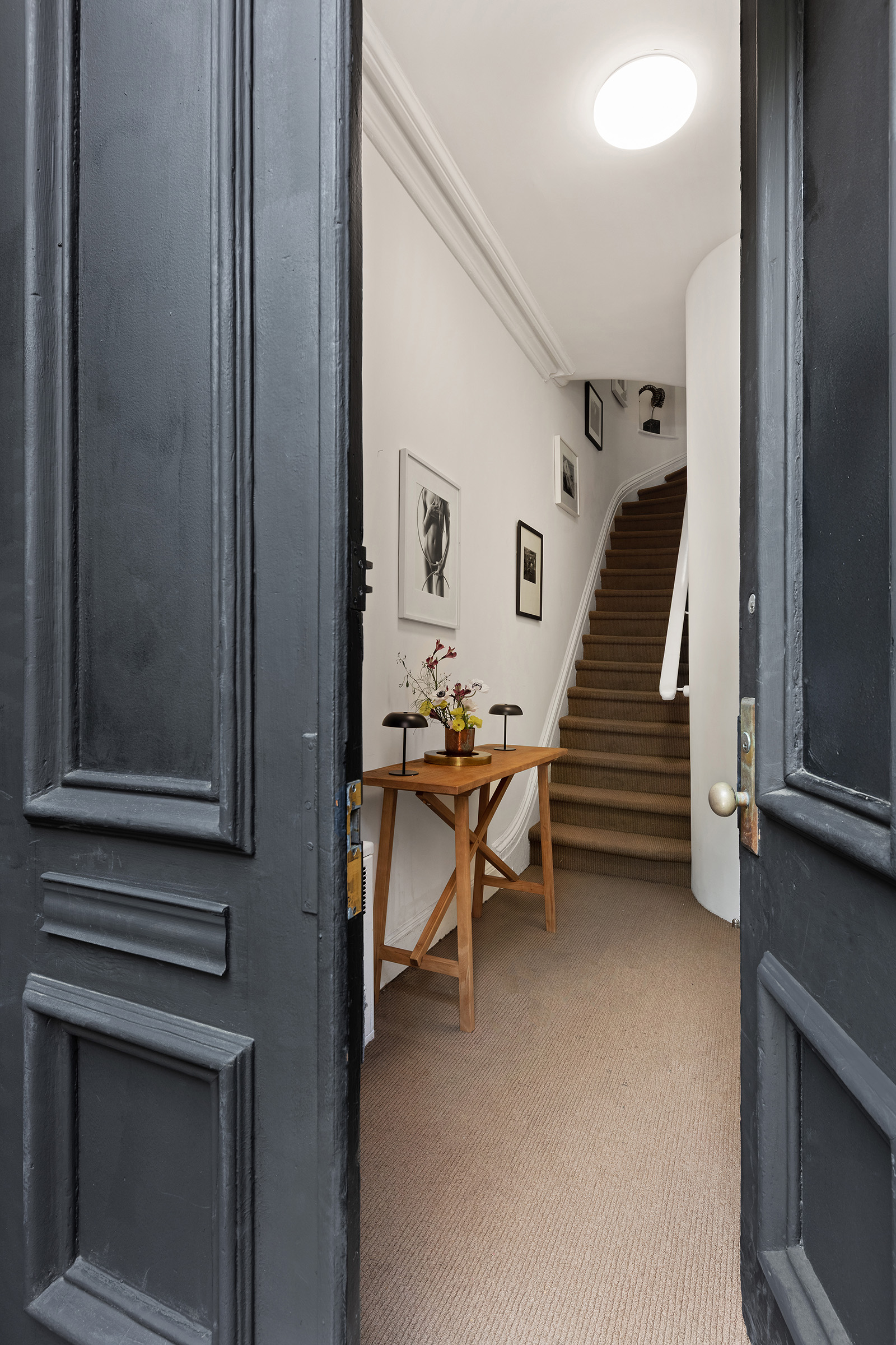 456 West 25th Street Manhattan, NY 10001 - Photo 15 of 22 a view of a livingroom with furniture and stairs