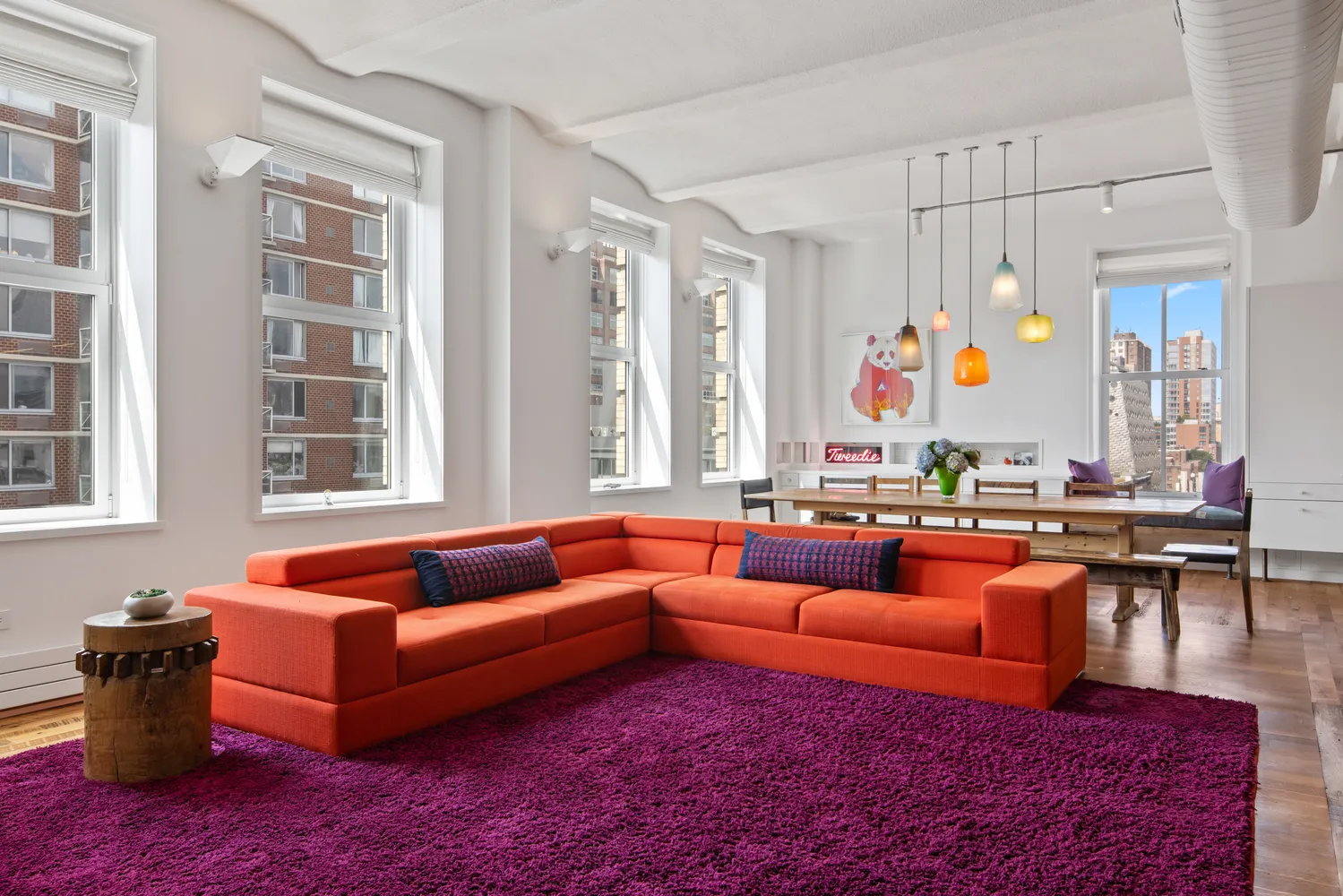 a living room filled with furniture and a large window