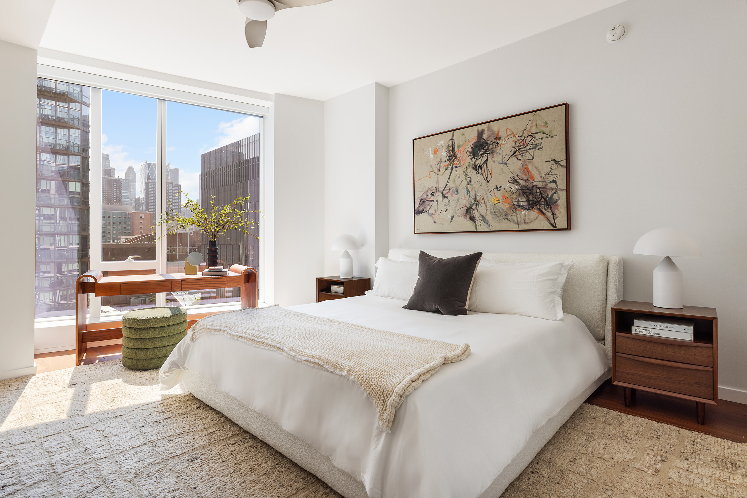 1 West End Avenue, Unit 15E Manhattan, NY 10023 - Photo 5 of 31 a bedroom with a large bed and a couch