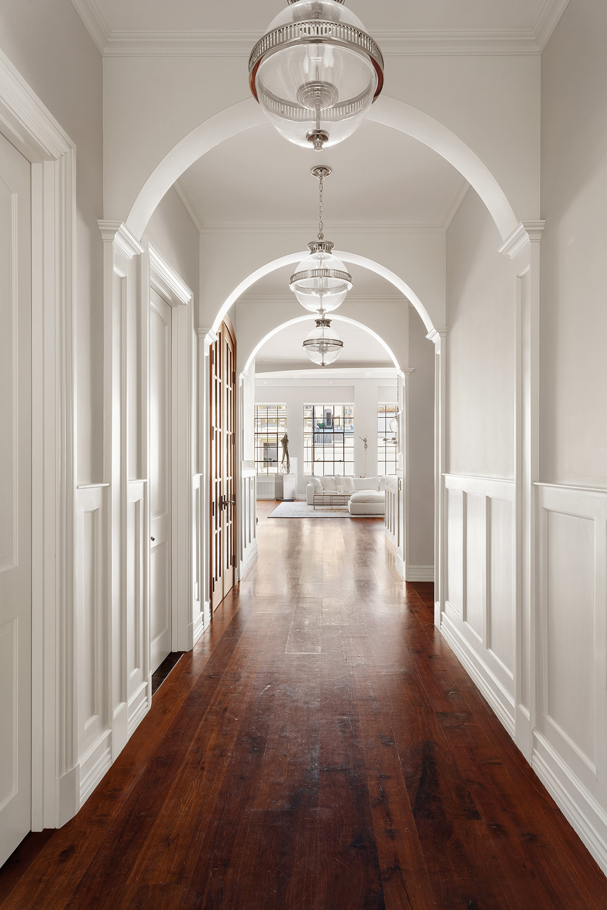 73 Wooster Street, Unit PHA Manhattan, NY 10012 - Photo 18 of 25 a view of a room with wooden floor chandelier and windows