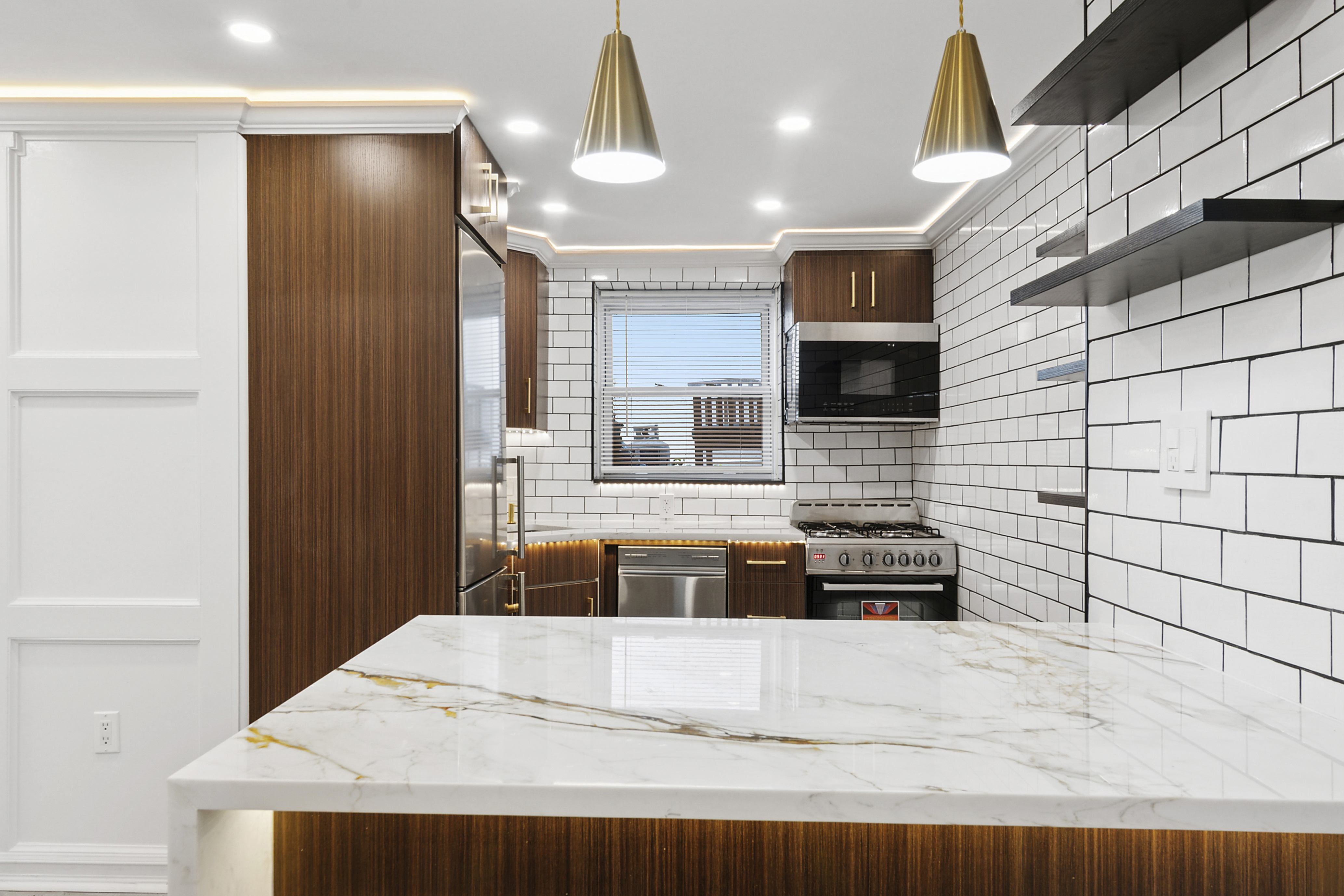 58-07 83rd Place, Unit 1 Queens, NY 11379 - Photo 3 of 5 a bathroom with a sink a bathtub and a shower