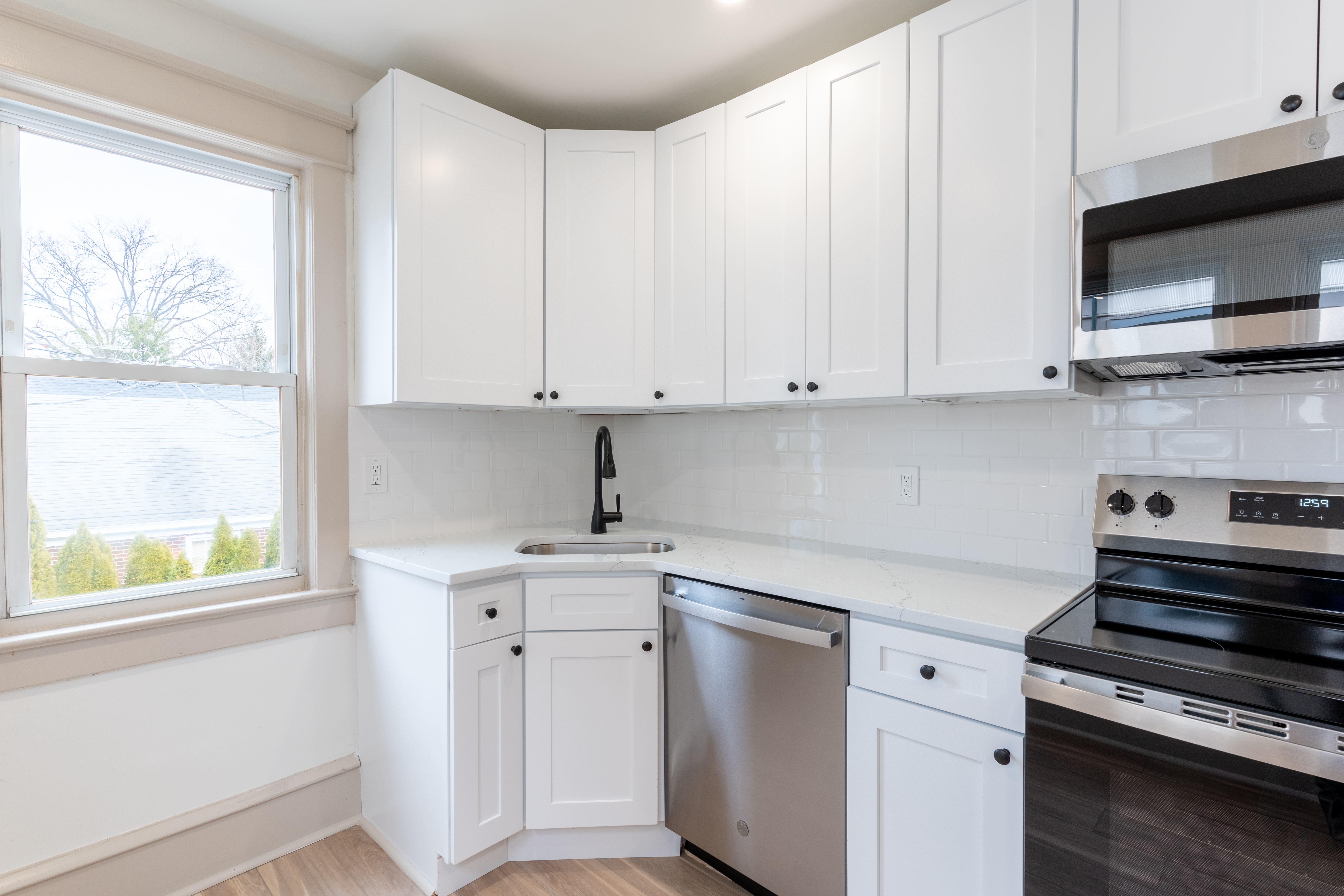 423 North Haddon Avenue Haddonfield, NJ 08033 - Photo 4 of 16 a kitchen with appliances cabinets and a window