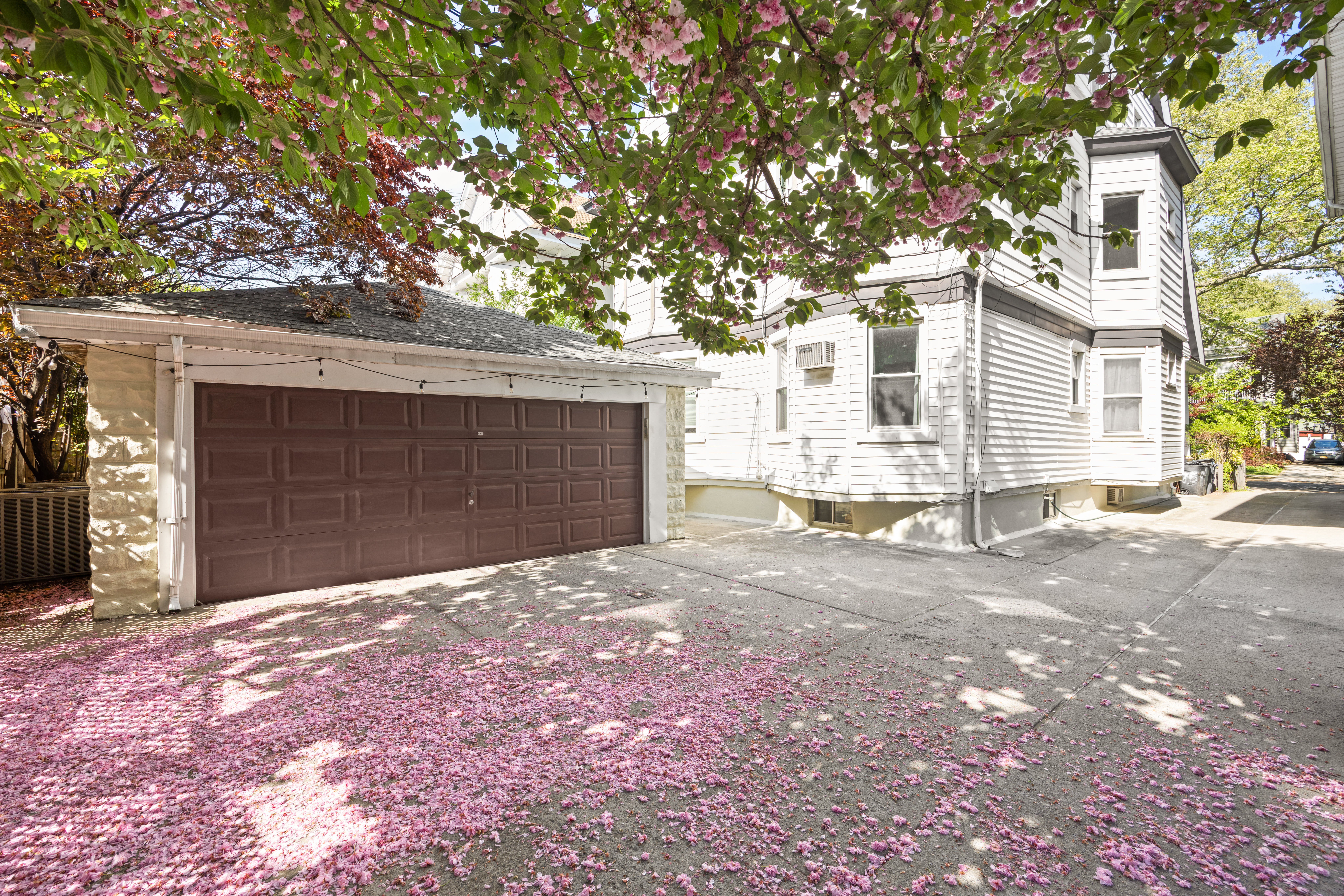 758 Westminster Road Brooklyn, NY 11230 - Photo 31 of 32 a front view of a house with a yard and garage