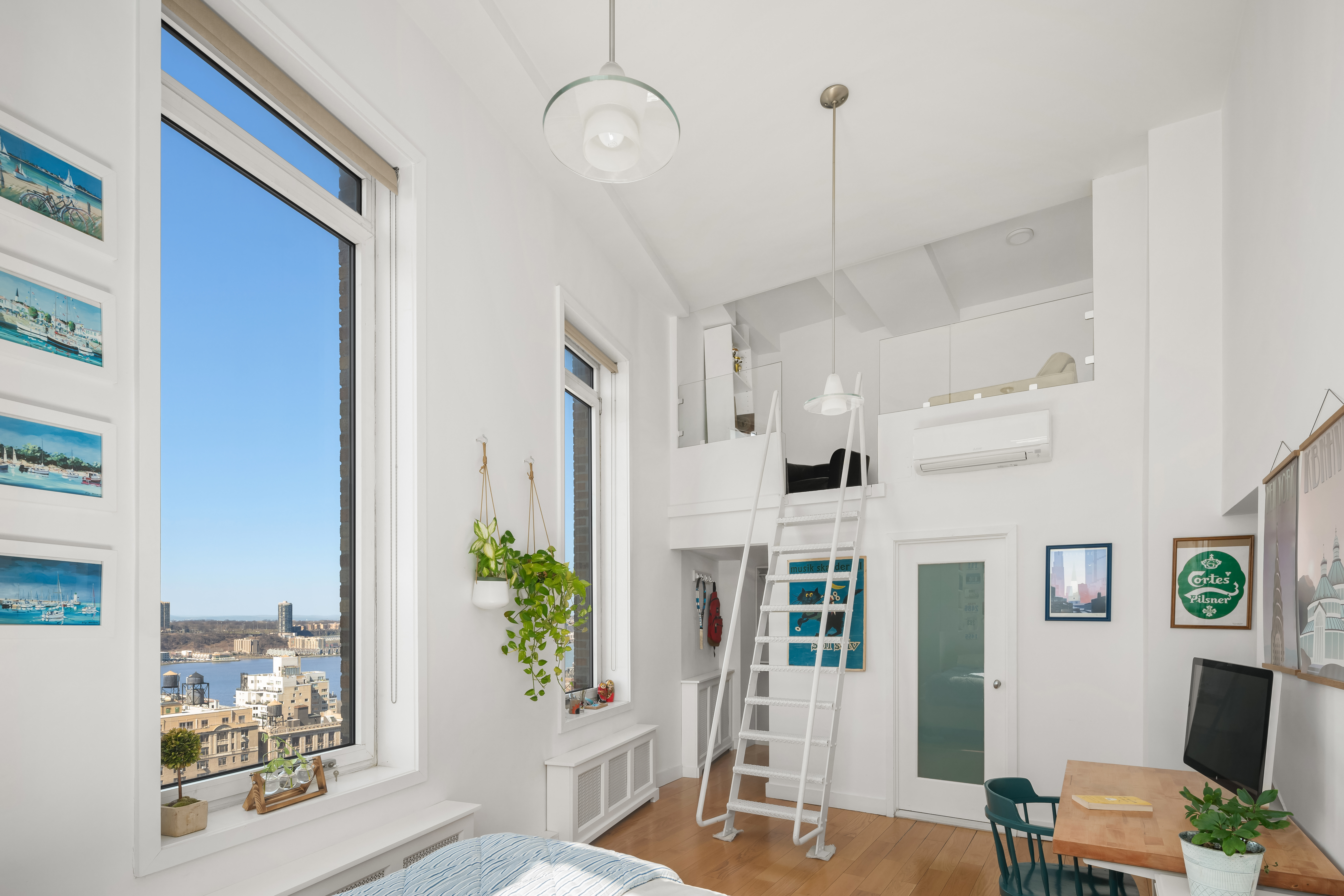 2166 Broadway, Unit PH Manhattan, NY 10024 - Photo 13 of 37 a living room with furniture windows and a potted plant