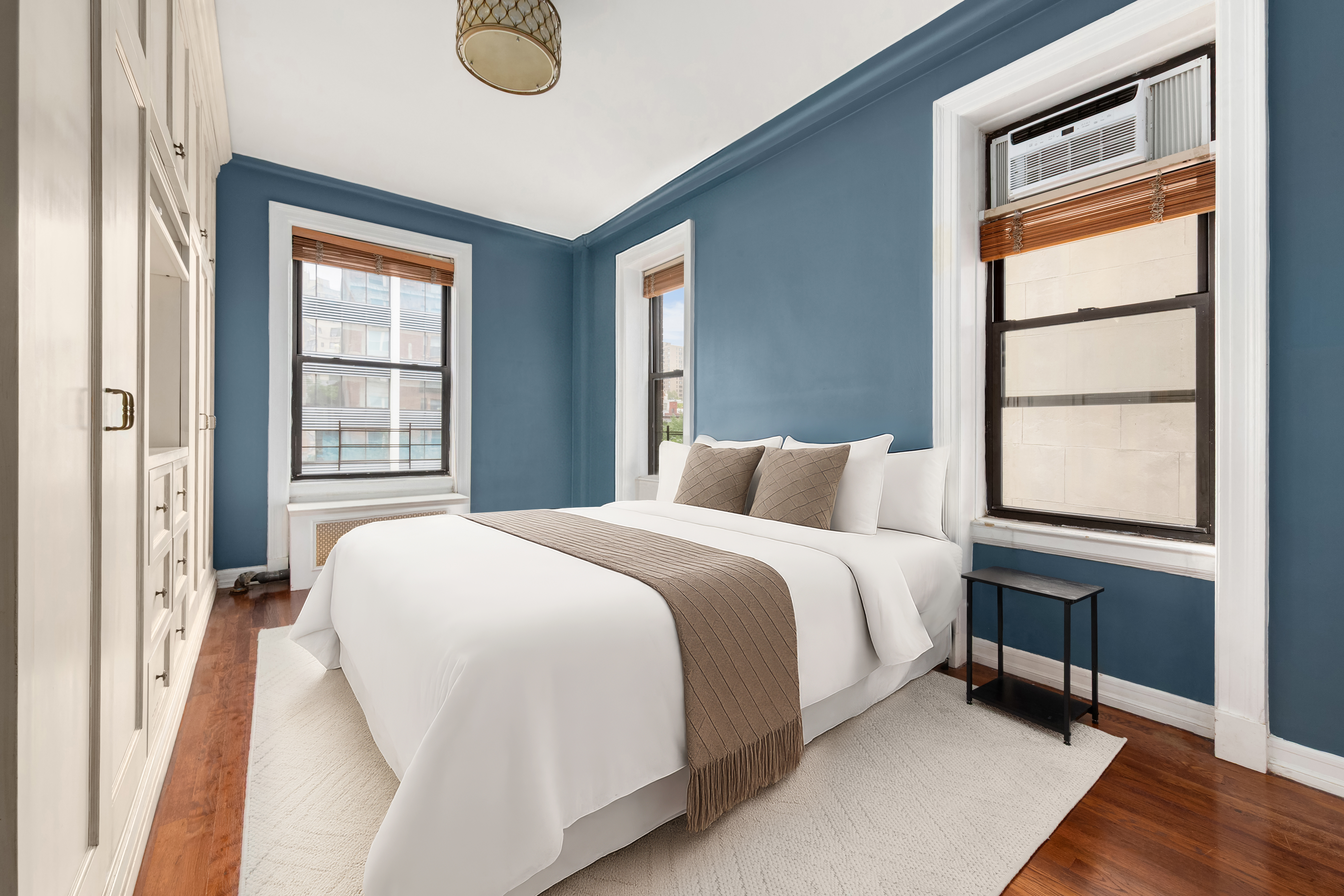 176 West 87th Street, Unit 3A Manhattan, NY 10024 - Photo 5 of 8 a bedroom with a bed and a window