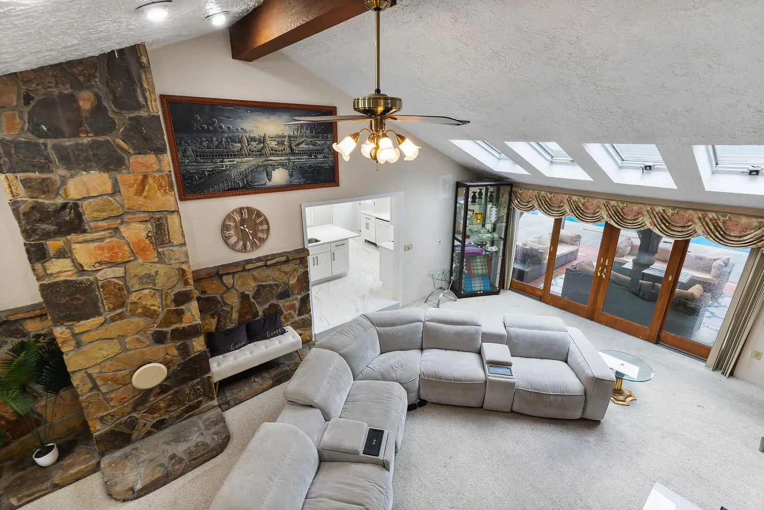 a living room with furniture and a chandelier