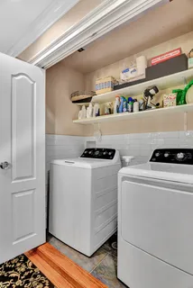 a utility room with washer and dryer