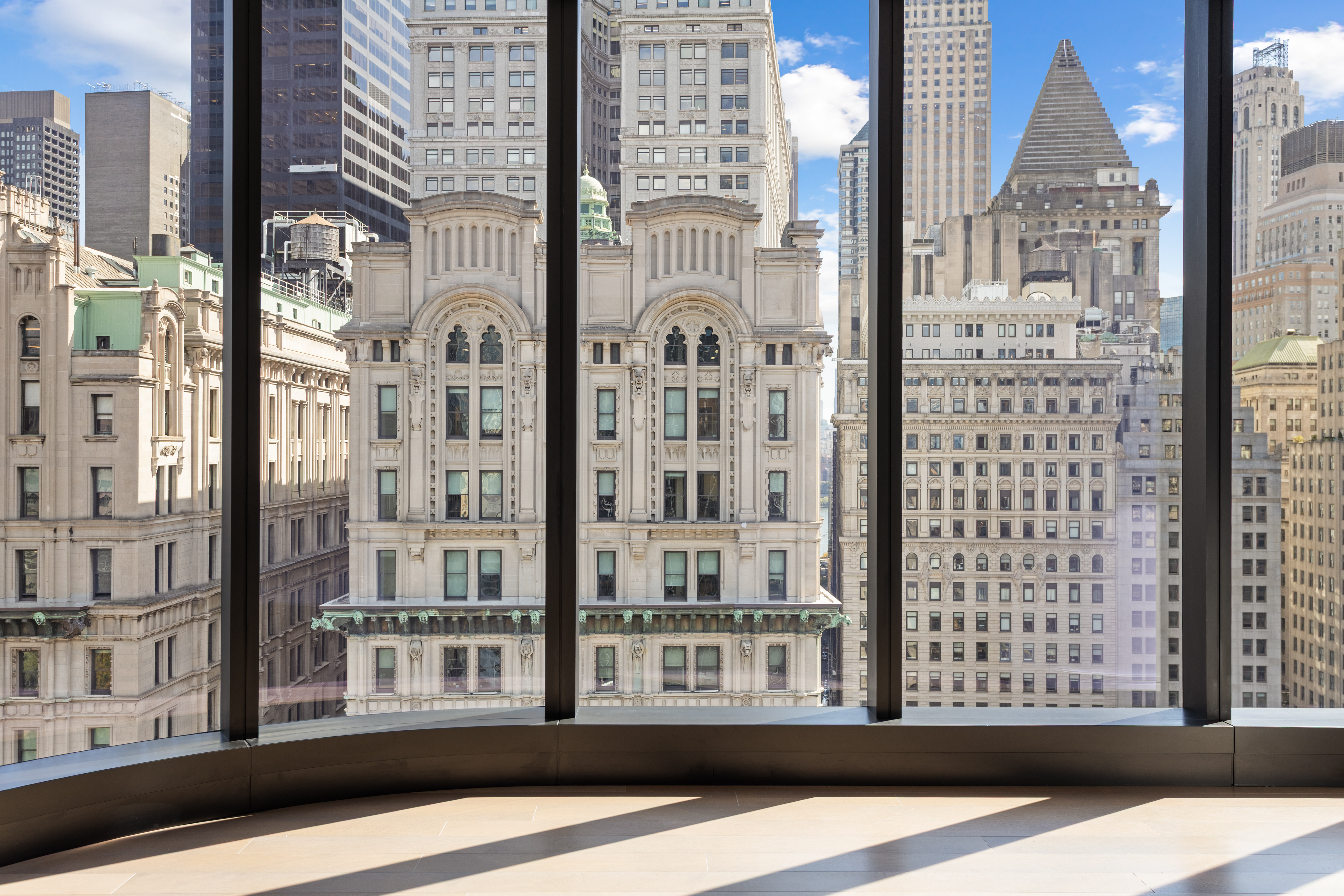 125 Greenwich Street, Unit 31A Manhattan, NY 10006 - Photo 8 of 23 a view of a building from a windows