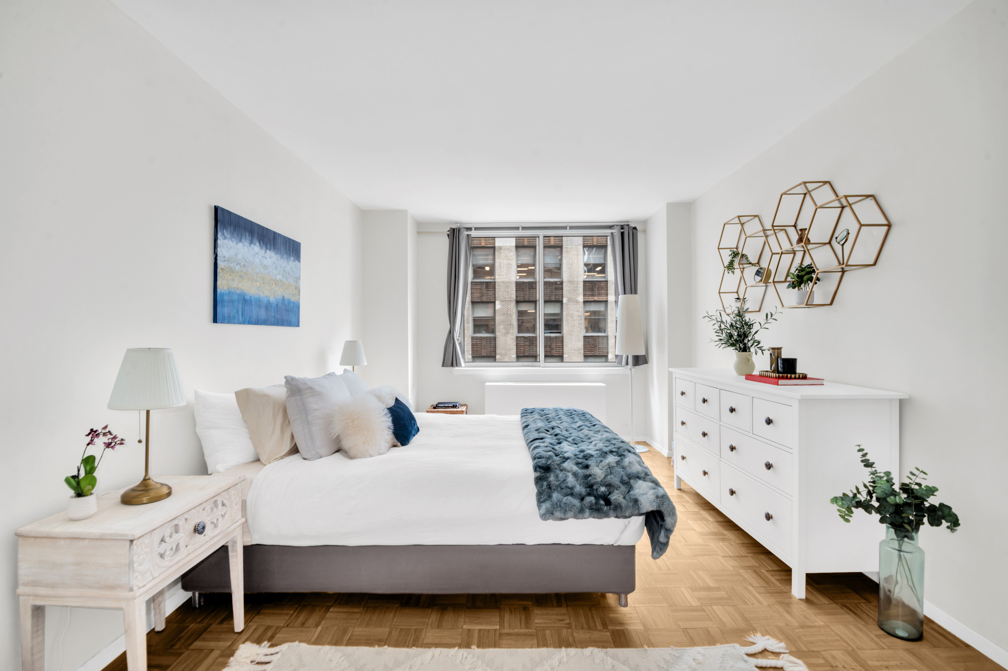 235 East 40th Street, Unit 11G Manhattan, NY 10016 - Photo 7 of 20 a bedroom with a bed and a window