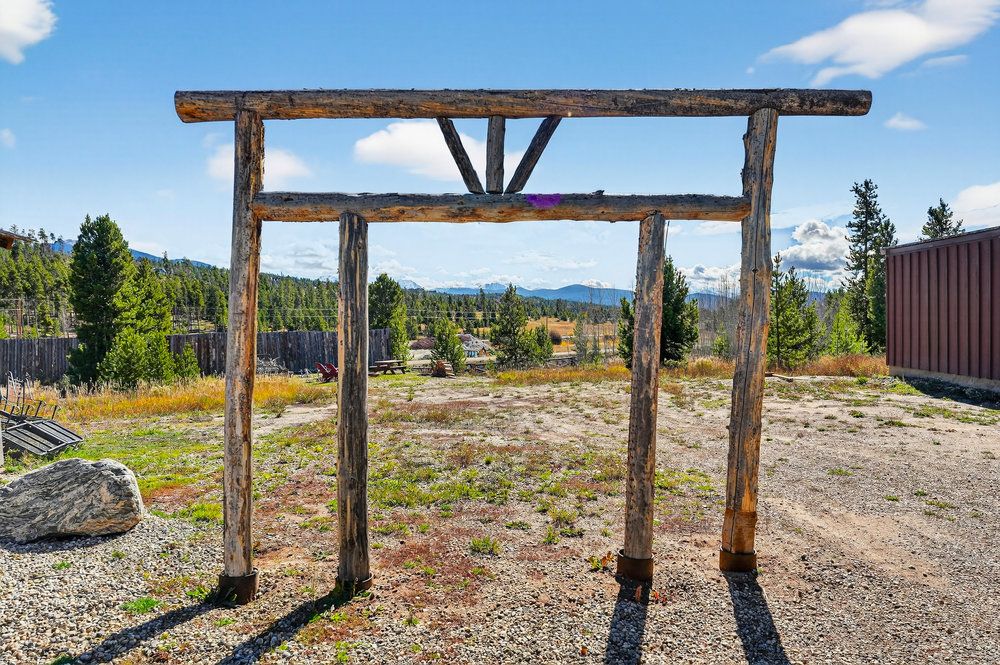 a view of backyard with a table and chairs